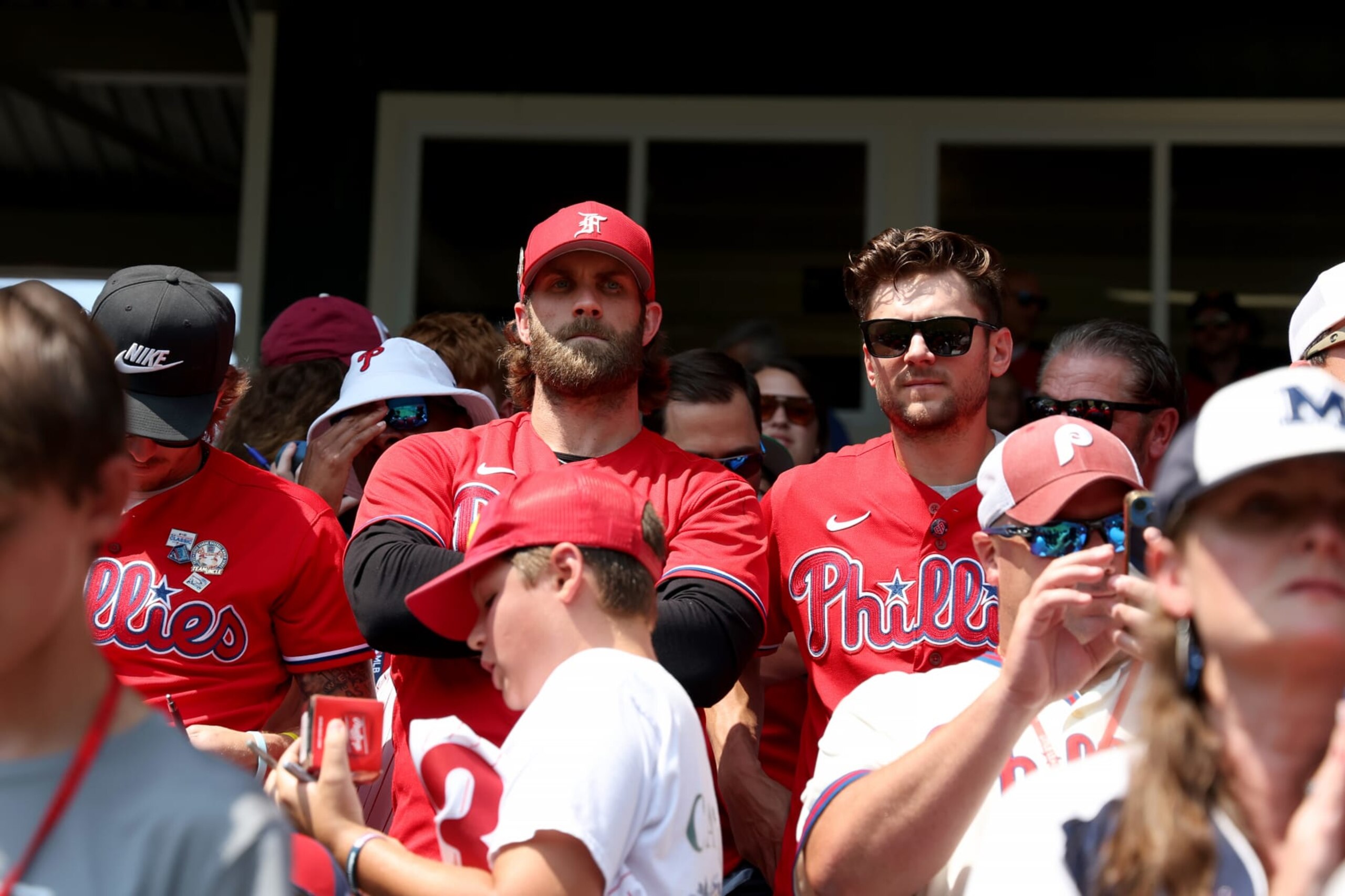 SOUTH WILLIAMSPORT, PENNSYLVANIA - AUGUST 20: Bryce Harper #3 (L) and Trea Turner #7 of the Philadelphia Phillies watch from the stands as members of the Phillies and Washington Nationals attended a Little League World Series game at Lamade Stadium before playing each other in the Little League Classic on August 20, 2023 in South Williamsport, Pennsylvania. (Photo by Rob Carr/Getty Images)