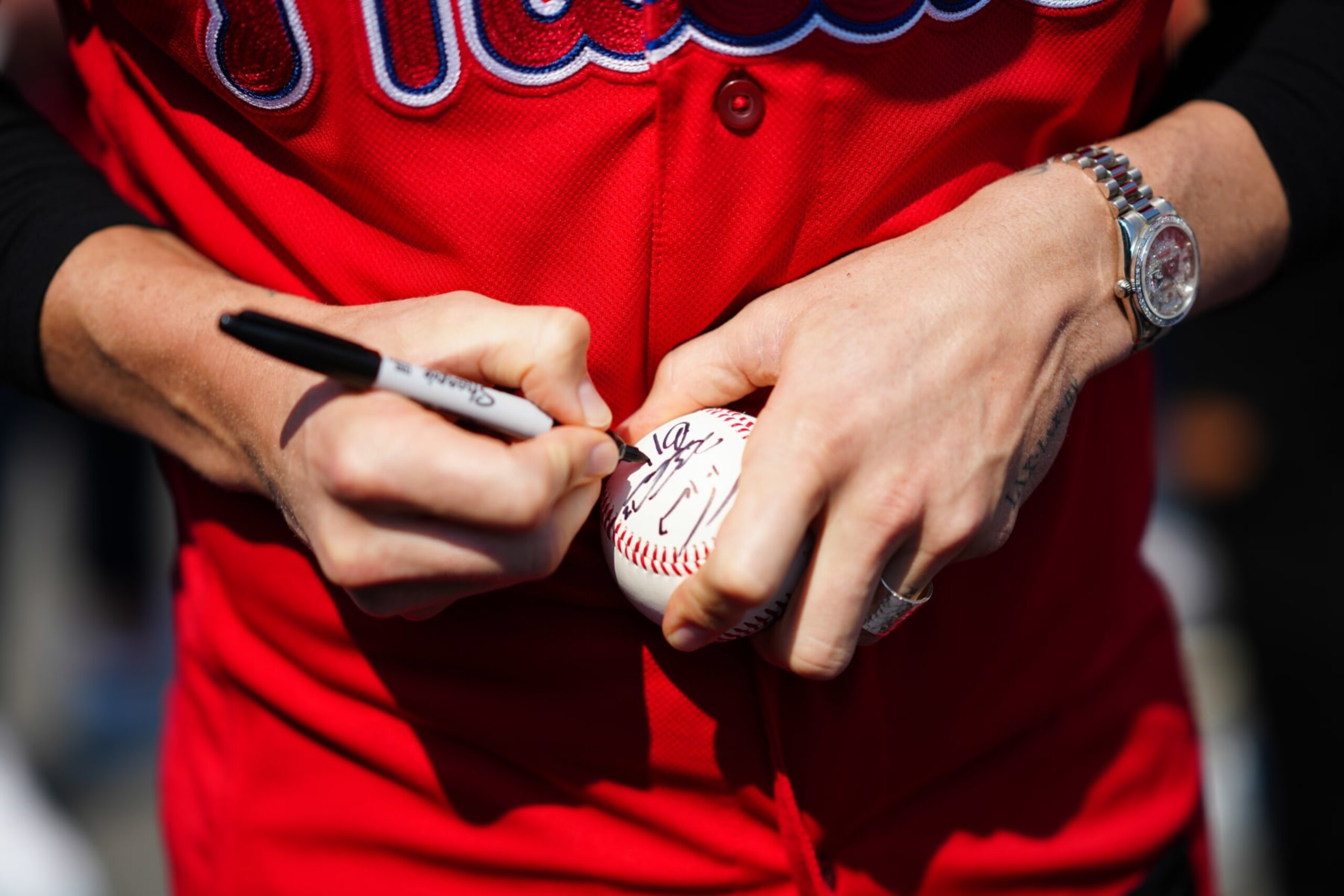WILLIAMSPORT, - AUGUST 20: Bryce Harper #3 of the Philadelphia Phillies signs a baseball for a fan at the airport prior to the game between the Philadelphia Phillies and the Washington Nationals at Muncy Bank Ballpark at Historic Bowman Field on Sunday, August 20, 2023 in Williamsport, Pennsylvania. (Photo by Daniel Shirey/MLB Photos via Getty Images) WILLIAMSPORT, - AUGUST 20: Bryce Harper #3 of the Philadelphia Phillies signs a baseball for a fan at the airport prior to the game between the Philadelphia Phillies and the Washington Nationals at Muncy Bank Ballpark at Historic Bowman Field on Sunday, August 20, 2023 in Williamsport, Pennsylvania. (Photo by Daniel Shirey/MLB Photos via Getty Images)