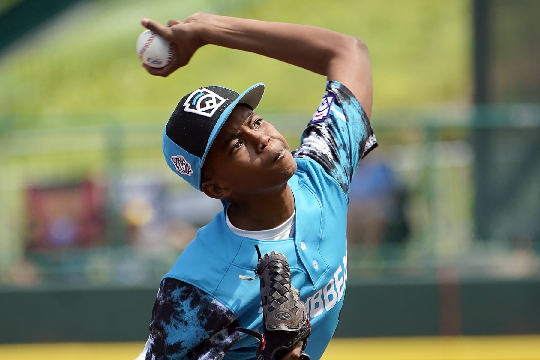 Curacao's starting pitcher Helmir Helmijr (17) delivers against Australia during the first inning of a baseball game at the Little League World Series tournament in South Williamsport, Pa., Thursday, Aug. 17, 2023. (AP Photo/Tom E. Puskar)
