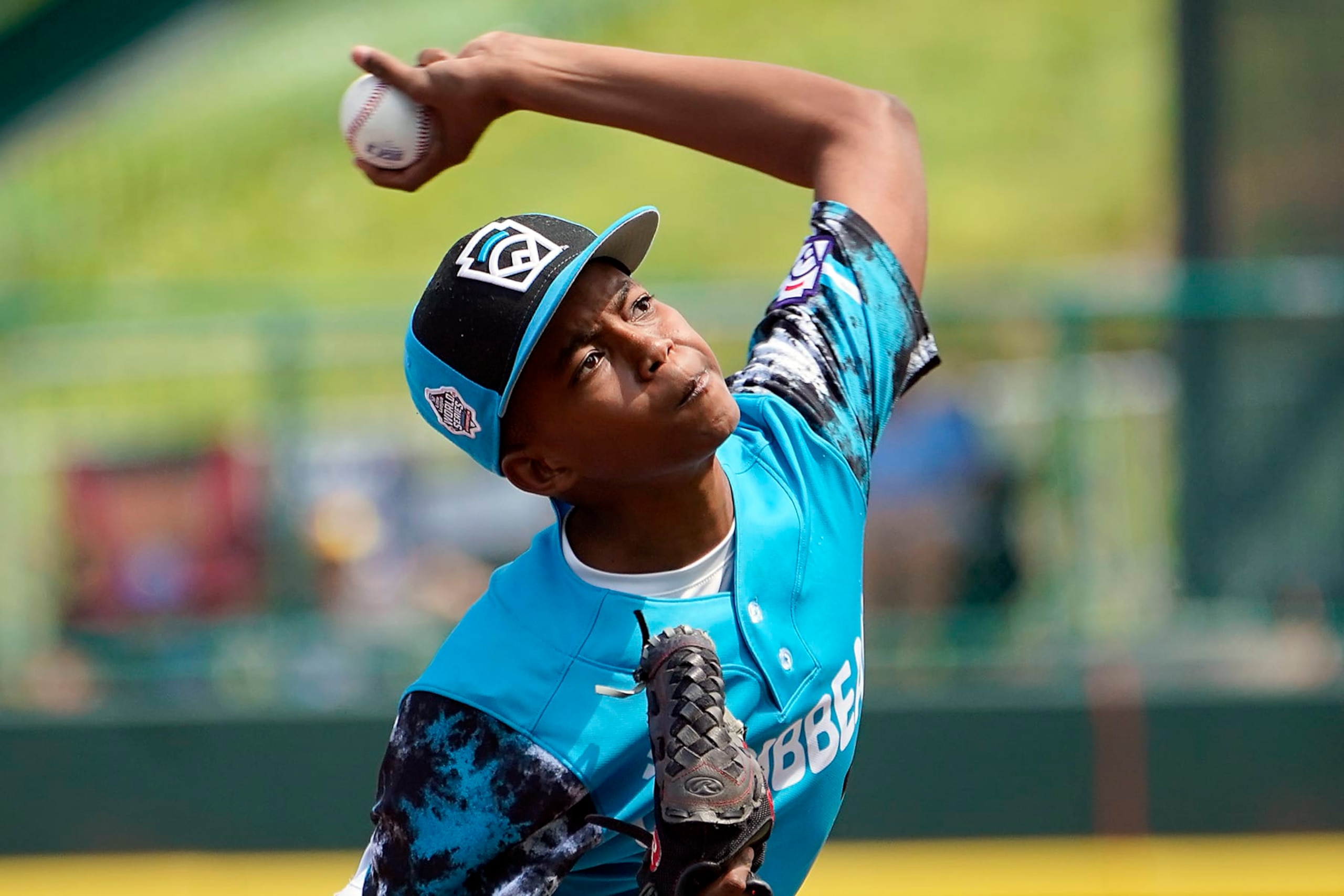 Curacao's starting pitcher Helmir Helmijr (17) delivers against Australia during the first inning of a baseball game at the Little League World Series tournament in South Williamsport, Pa., Thursday, Aug. 17, 2023. (AP Photo/Tom E. Puskar) Curacao's starting pitcher Helmir Helmijr (17) delivers against Australia during the first inning of a baseball game at the Little League World Series tournament in South Williamsport, Pa., Thursday, Aug. 17, 2023. (AP Photo/Tom E. Puskar)