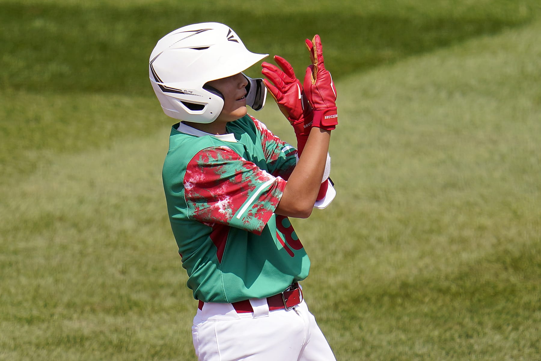 Mexico's Gael Leyva (18) celebrates standing on second base after a double against Canada during the fourth inning of a baseball game at the Little League World Series tournament in South Williamsport, Pa., Sunday, Aug. 20, 2023. (AP Photo/Tom E. Puskar)
