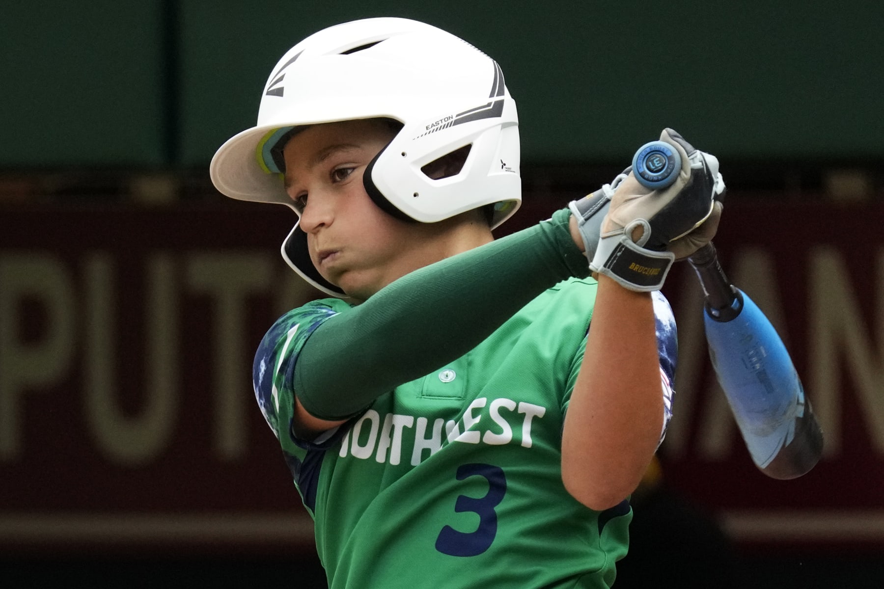 Seattle, Wash.'s Matthew Fischer singles off Gray, Maine's Kayden Oliver, driving in a run, during the third inning of a baseball game at the Little League World Series in South Williamsport, Pa., Thursday, Aug. 17, 2023. Washington won 10-0. (AP Photo/Gene J. Puskar)