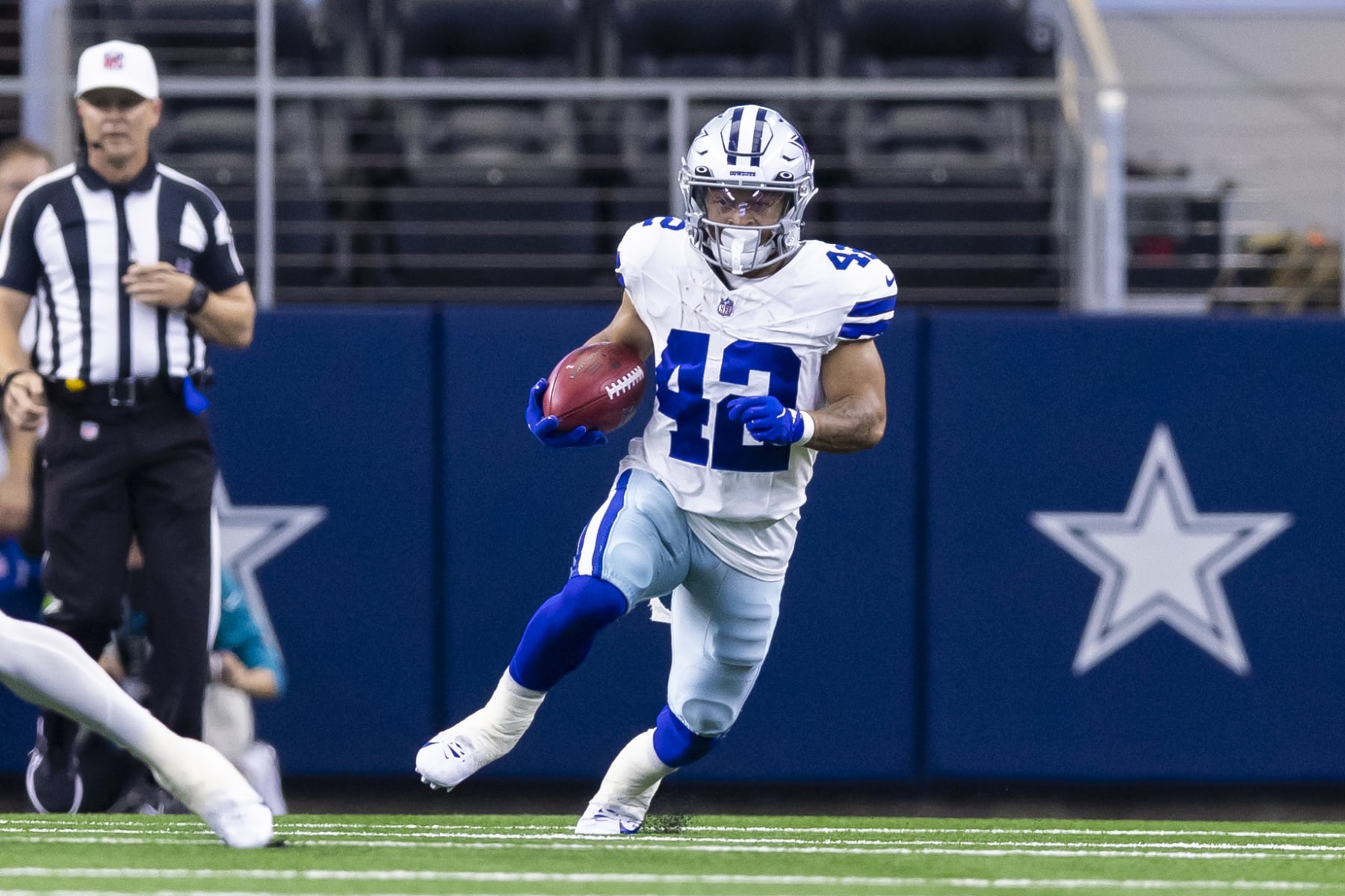 Dallas Cowboys running back Deuce Vaughn (42) carries the ball during the first half of an NFL football game against the Jacksonville Jaguars, Saturday, Aug. 12, 2023, in Arlington, Texas. Jacksonville won 28-23. (AP Photo/Brandon Wade)