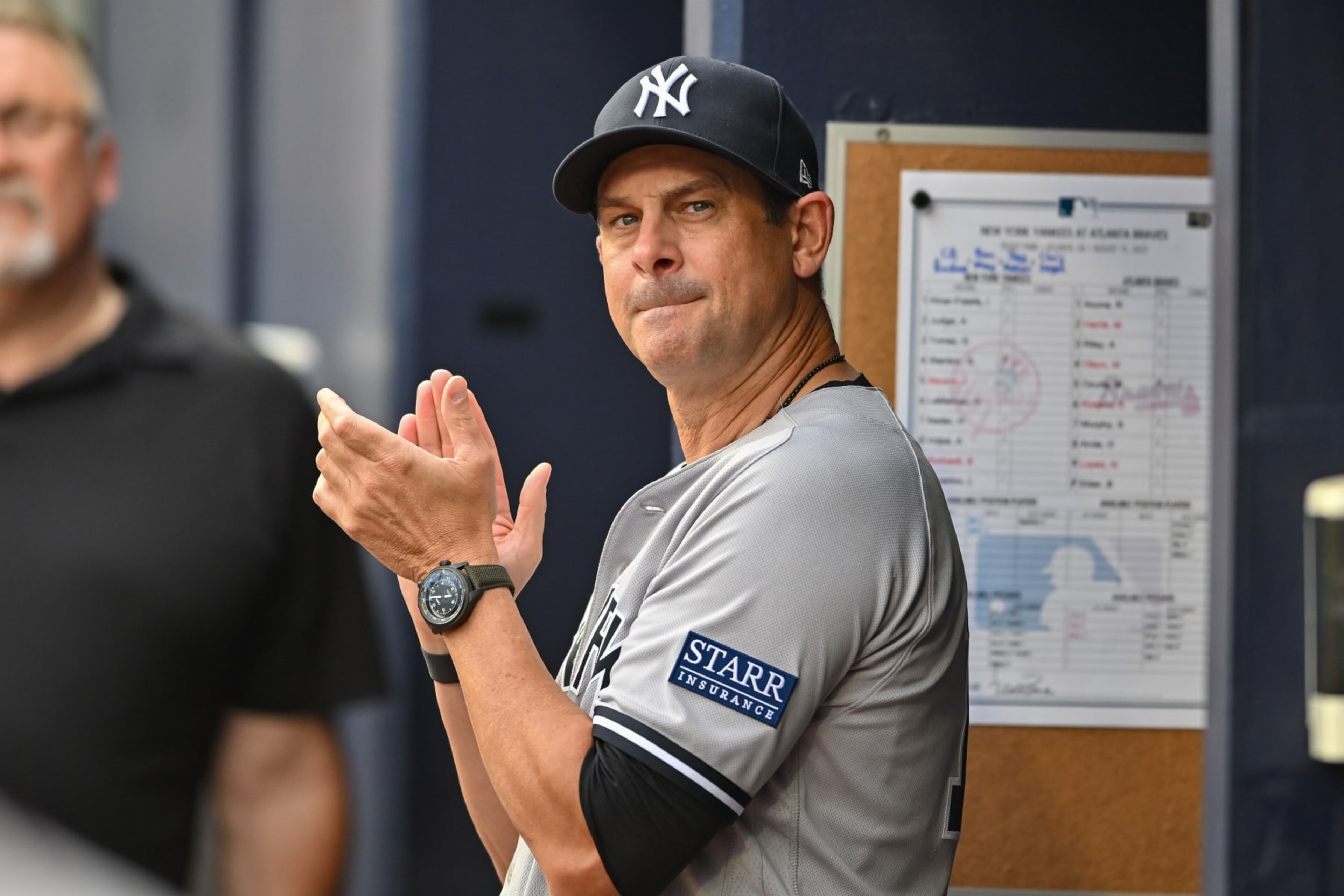 ATLANTA, GA  AUGUST 15:  New York manager Aaron Boone (17) reacts in the dugout during the MLB game between the New York Yankees and the Atlanta Braves on August 15th, 2023 at Truist Park in Atlanta, GA. (Photo by Rich von Biberstein/Icon Sportswire via Getty Images)