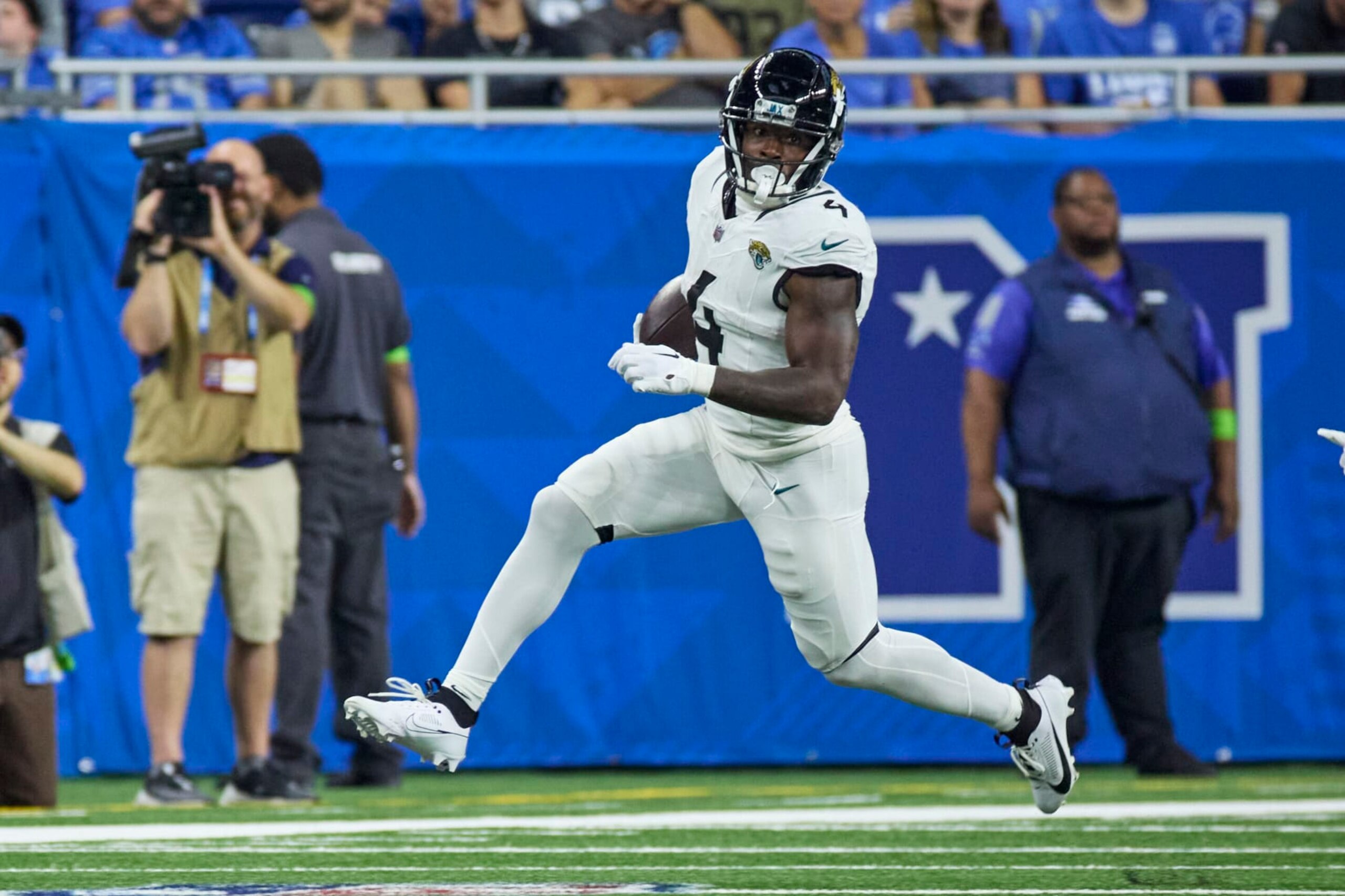 Jacksonville Jaguars running back Tank Bigsby (4) rushes against the Detroit Lions during an NFL pre-season football game, Saturday, Aug. 19, 2023, in Detroit. (AP Photo/Rick Osentoski)