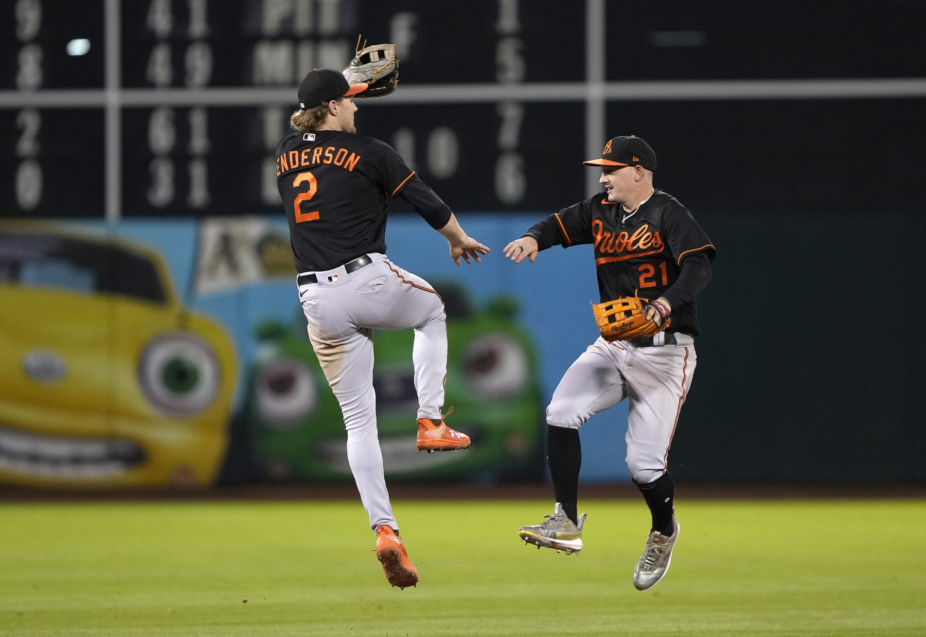OAKLAND, CALIFORNIA - AUGUST 18: Gunnar Henderson #2 and Austin Hays #21 of the Baltimore Orioles celebrates defeating the Oakland Athletics 9-4 at RingCentral Coliseum on August 18, 2023 in Oakland, California. (Photo by Thearon W. Henderson/Getty Images)