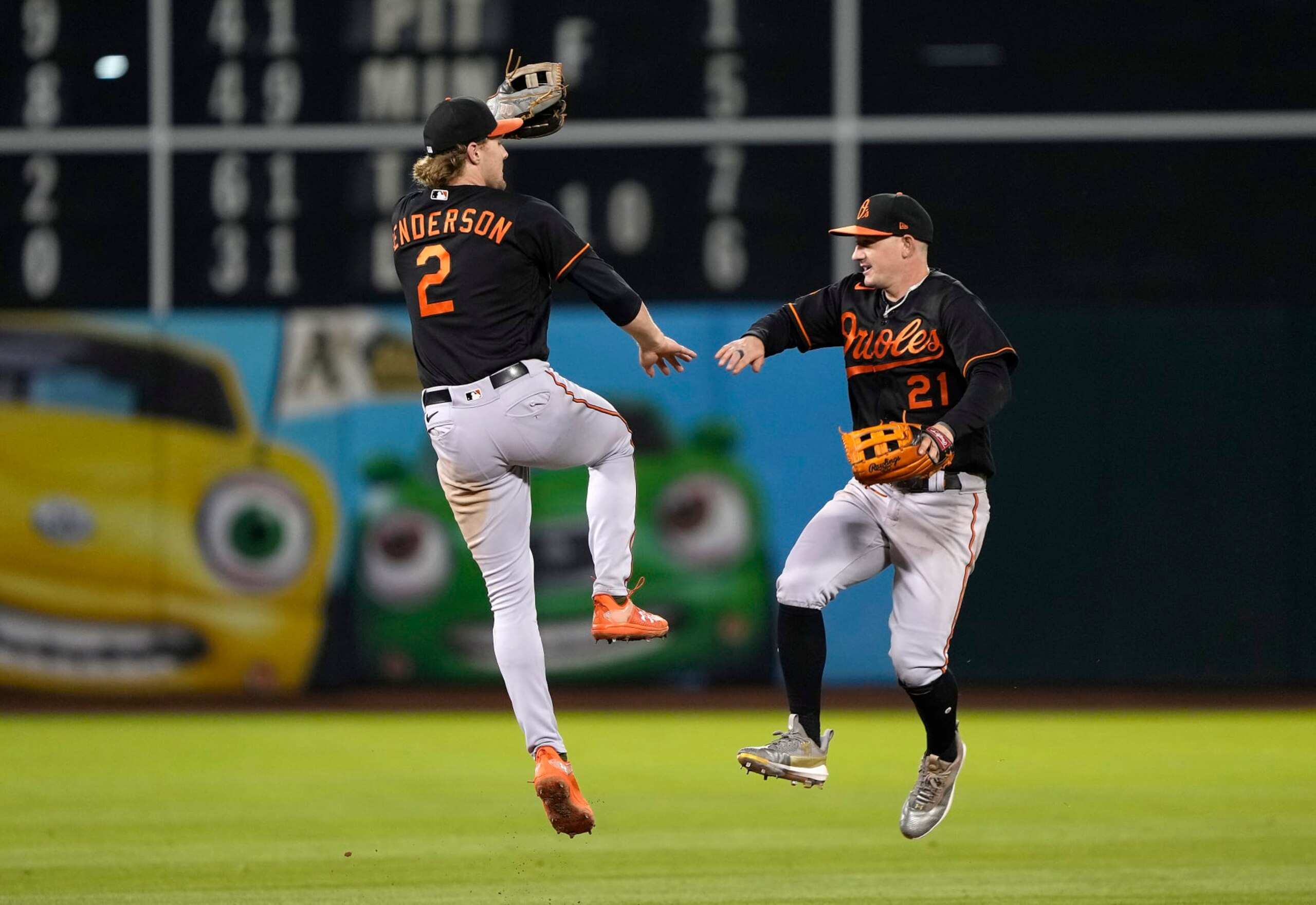 OAKLAND, CALIFORNIA - AUGUST 18: Gunnar Henderson #2 and Austin Hays #21 of the Baltimore Orioles celebrates defeating the Oakland Athletics 9-4 at RingCentral Coliseum on August 18, 2023 in Oakland, California. (Photo by Thearon W. Henderson/Getty Images)