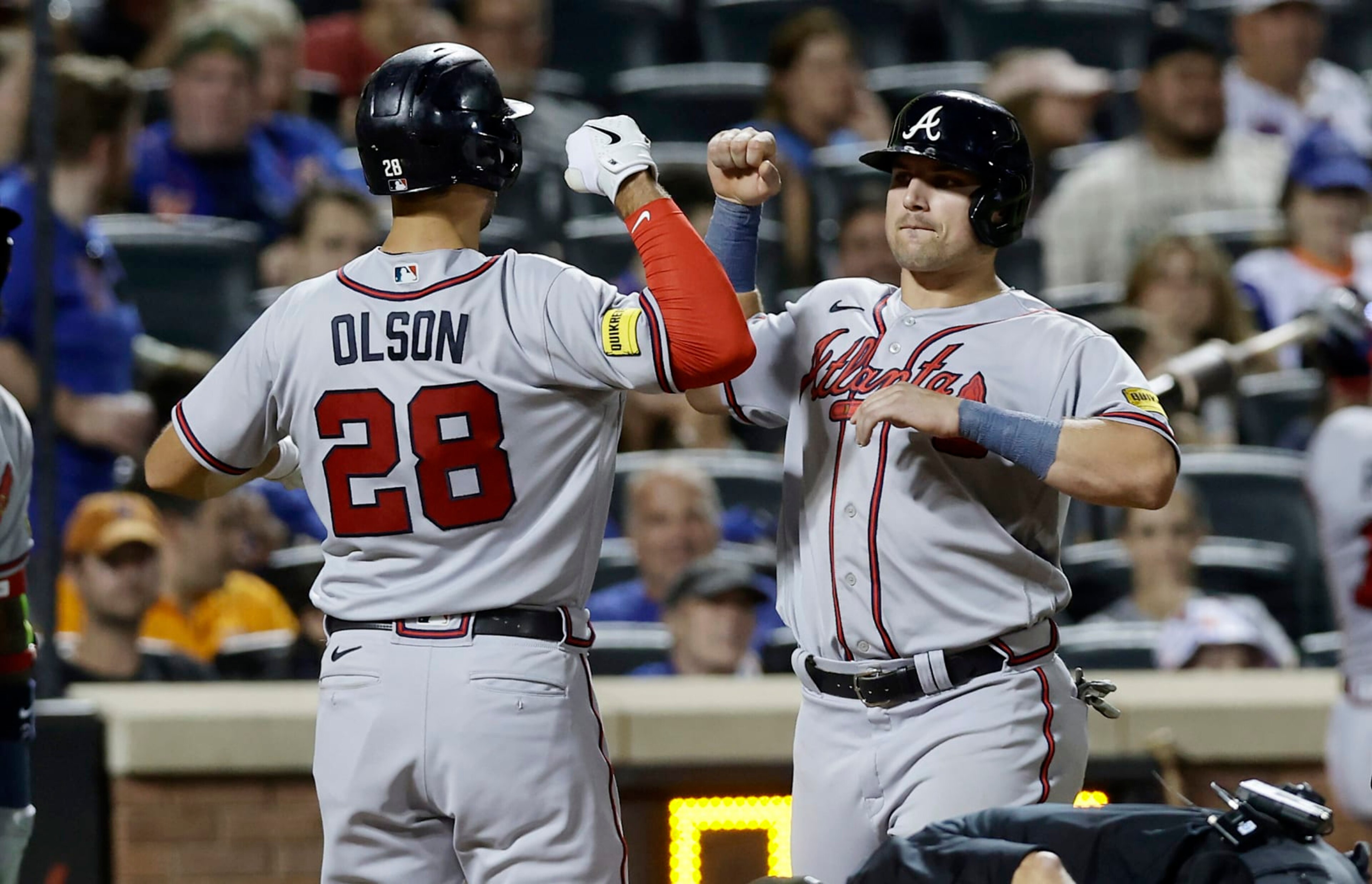NEW YORK, NEW YORK - AUGUST 13:  Matt Olson #28 of the Atlanta Braves celebrates his eighth inning two-run home run against the New York Mets with teammate Austin Riley #27 at Citi Field on August 13, 2023 in New York City. (Photo by Jim McIsaac/Getty Images)