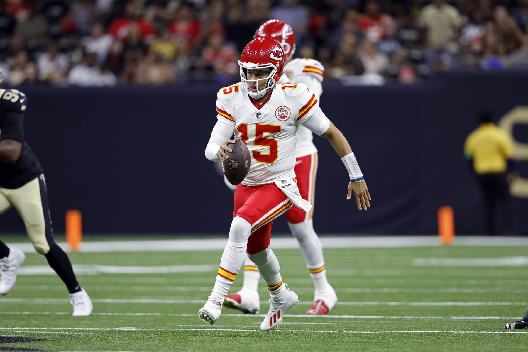 Kansas City Chiefs quarterback Patrick Mahomes (15) runs the ball during an NFL preseason football game against the New Orleans Saints, Sunday, Aug. 13, 2023, in New Orleans. (AP Photo/Tyler Kaufman)