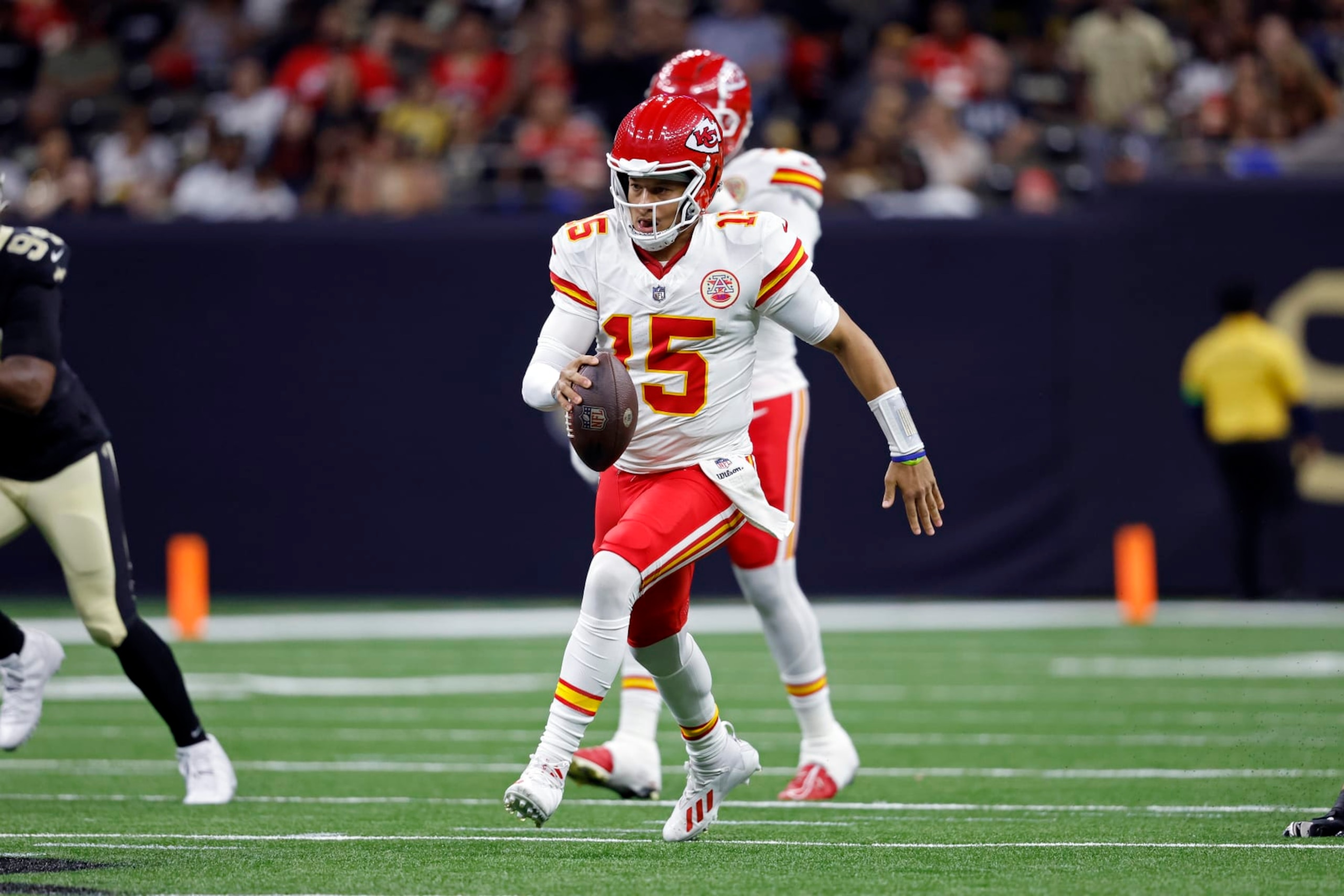 Kansas City Chiefs quarterback Patrick Mahomes (15) runs the ball during an NFL preseason football game against the New Orleans Saints, Sunday, Aug. 13, 2023, in New Orleans. (AP Photo/Tyler Kaufman)