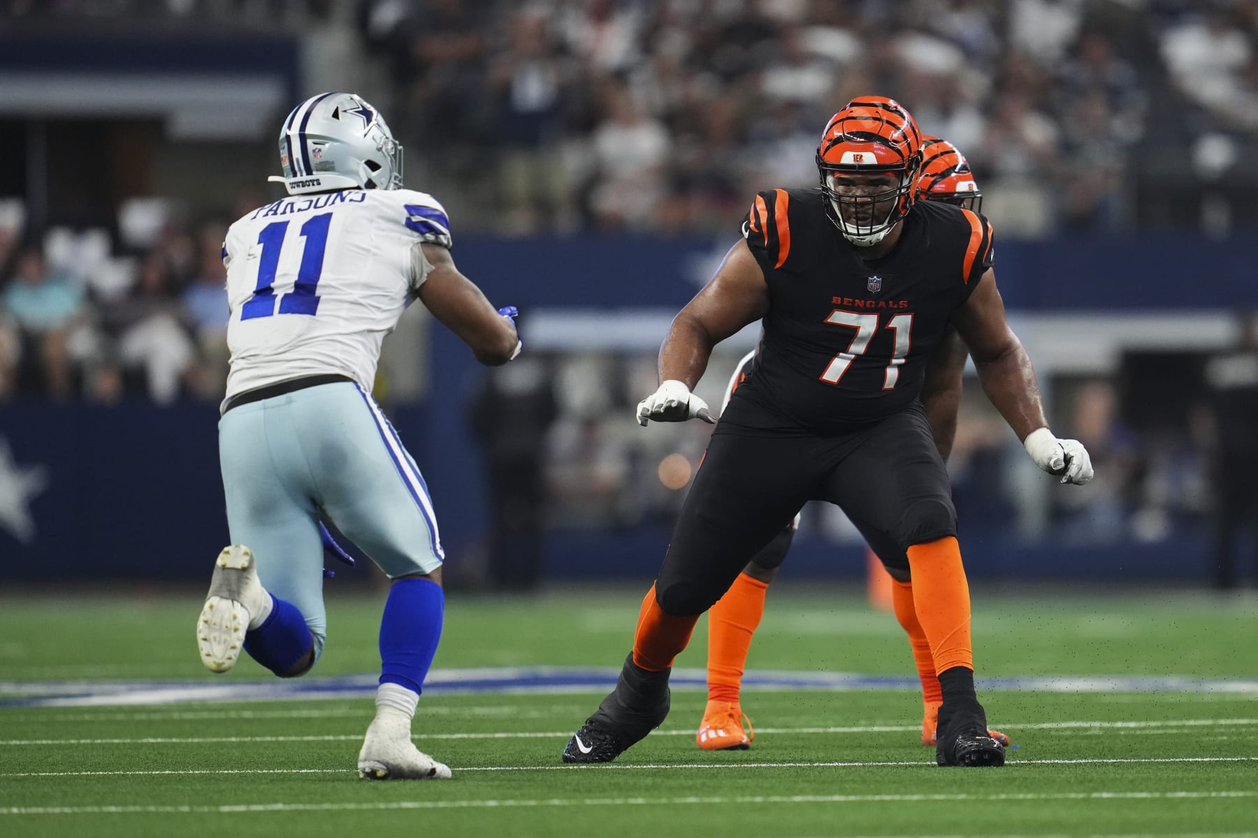 ARLINGTON, TX - SEPTEMBER 18: La'el Collins #71 of the Cincinnati Bengals defends against Micah Parsons #11 of the Dallas Cowboys at AT&T Stadium on September 18, 2022 in Arlington, Texas. (Photo by Cooper Neill/Getty Images)