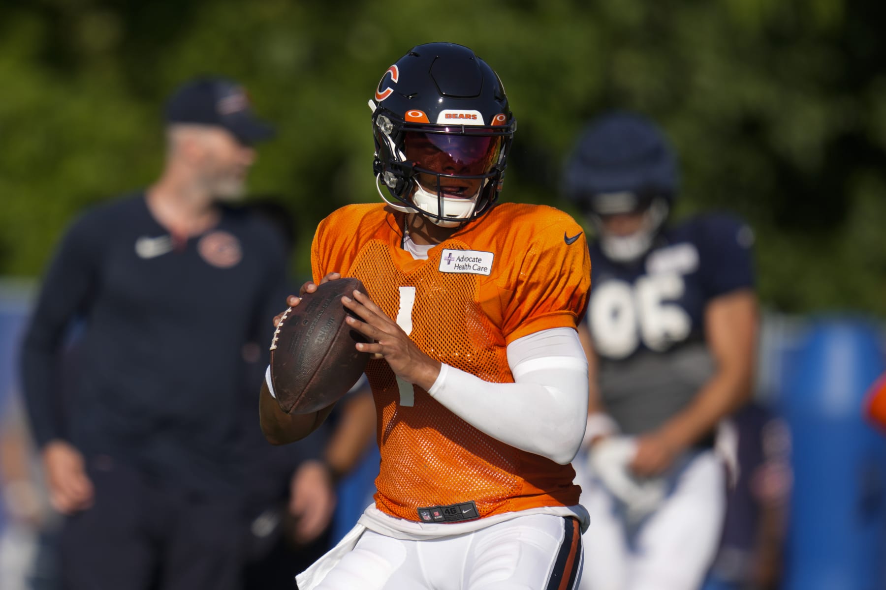 Chicago Bears quarterback Justin Fields (1) looks for a receiver during an NFL football joint practice with the Indianapolis Colts at the Colts' training camp in Westfield, Ind., Wednesday, Aug. 16, 2023. (AP Photo/Michael Conroy)