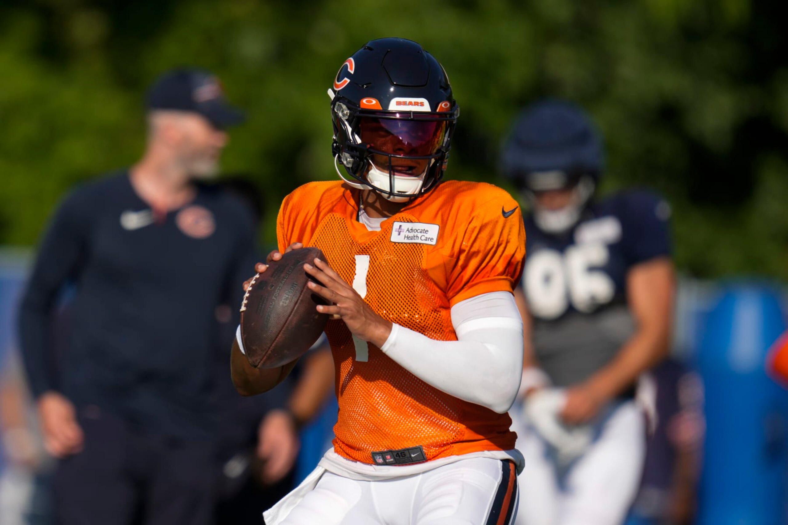 Chicago Bears quarterback Justin Fields (1) looks for a receiver during an NFL football joint practice with the Indianapolis Colts at the Colts' training camp in Westfield, Ind., Wednesday, Aug. 16, 2023. (AP Photo/Michael Conroy)