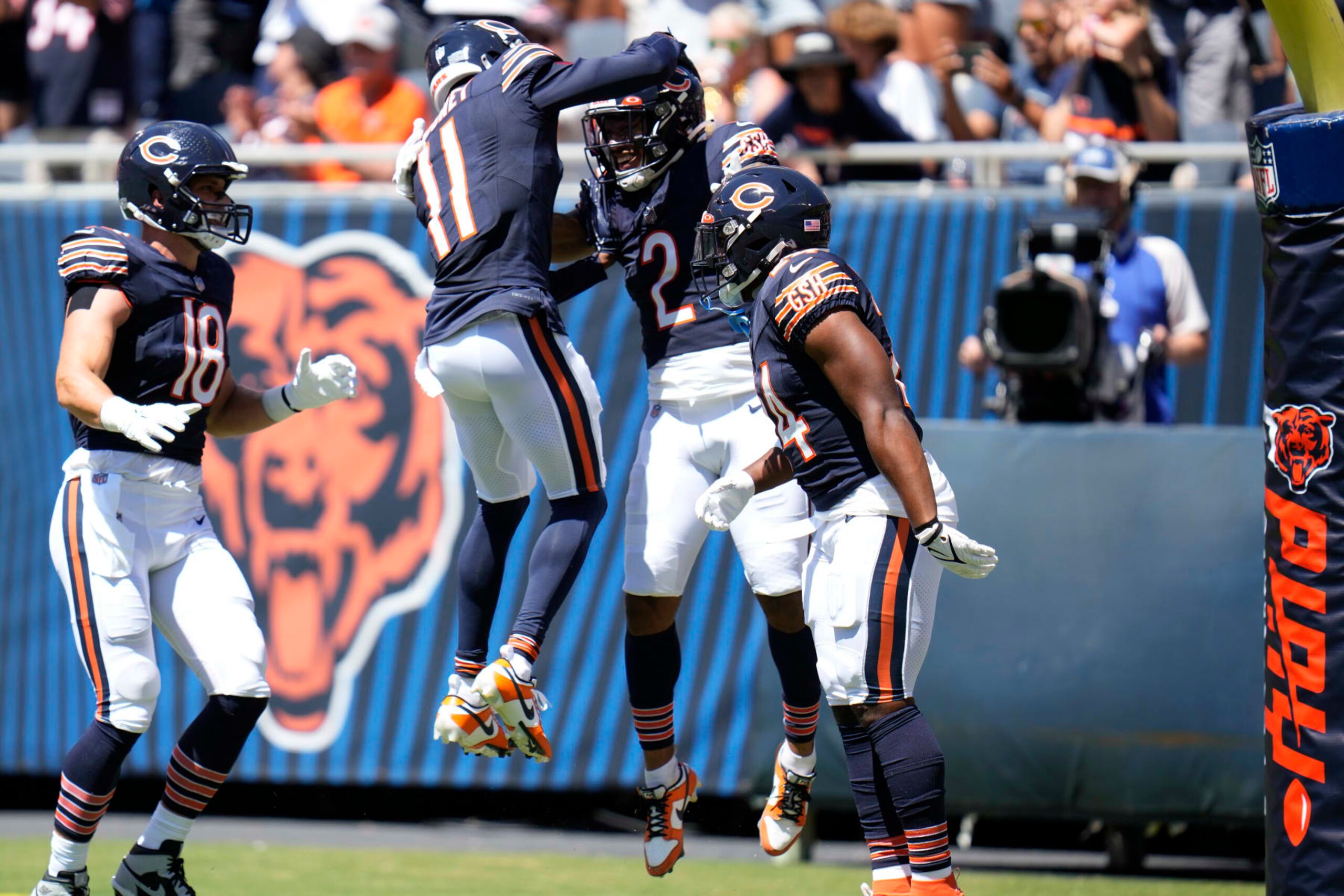Chicago Bears wide receiver DJ Moore (2) celebrates his touchdown with wide receiver Darnell Mooney (11) during the first half of an NFL preseason football game against the Tennessee Titans, Saturday, Aug. 12, 2023, in Chicago. (AP Photo/Erin Hooley)