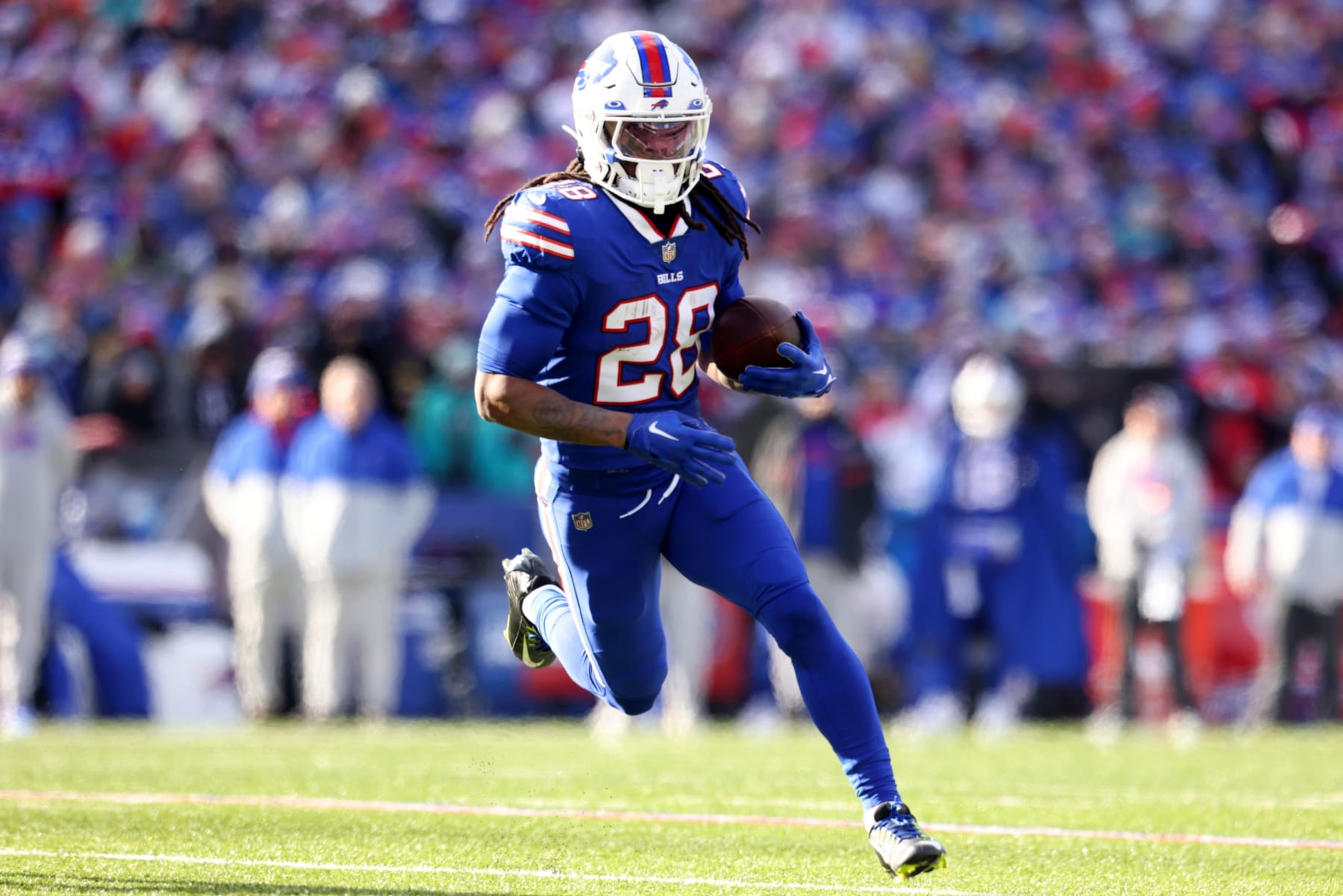 ORCHARD PARK, NEW YORK - JANUARY 15: James Cook #28 of the Buffalo Bills rushes for a touchdown against the Miami Dolphins during the first quarter of the game in the AFC Wild Card playoff game at Highmark Stadium on January 15, 2023 in Orchard Park, New York. (Photo by Bryan M. Bennett/Getty Images) ORCHARD PARK, NEW YORK - JANUARY 15: James Cook #28 of the Buffalo Bills rushes for a touchdown against the Miami Dolphins during the first quarter of the game in the AFC Wild Card playoff game at Highmark Stadium on January 15, 2023 in Orchard Park, New York. (Photo by Bryan M. Bennett/Getty Images)