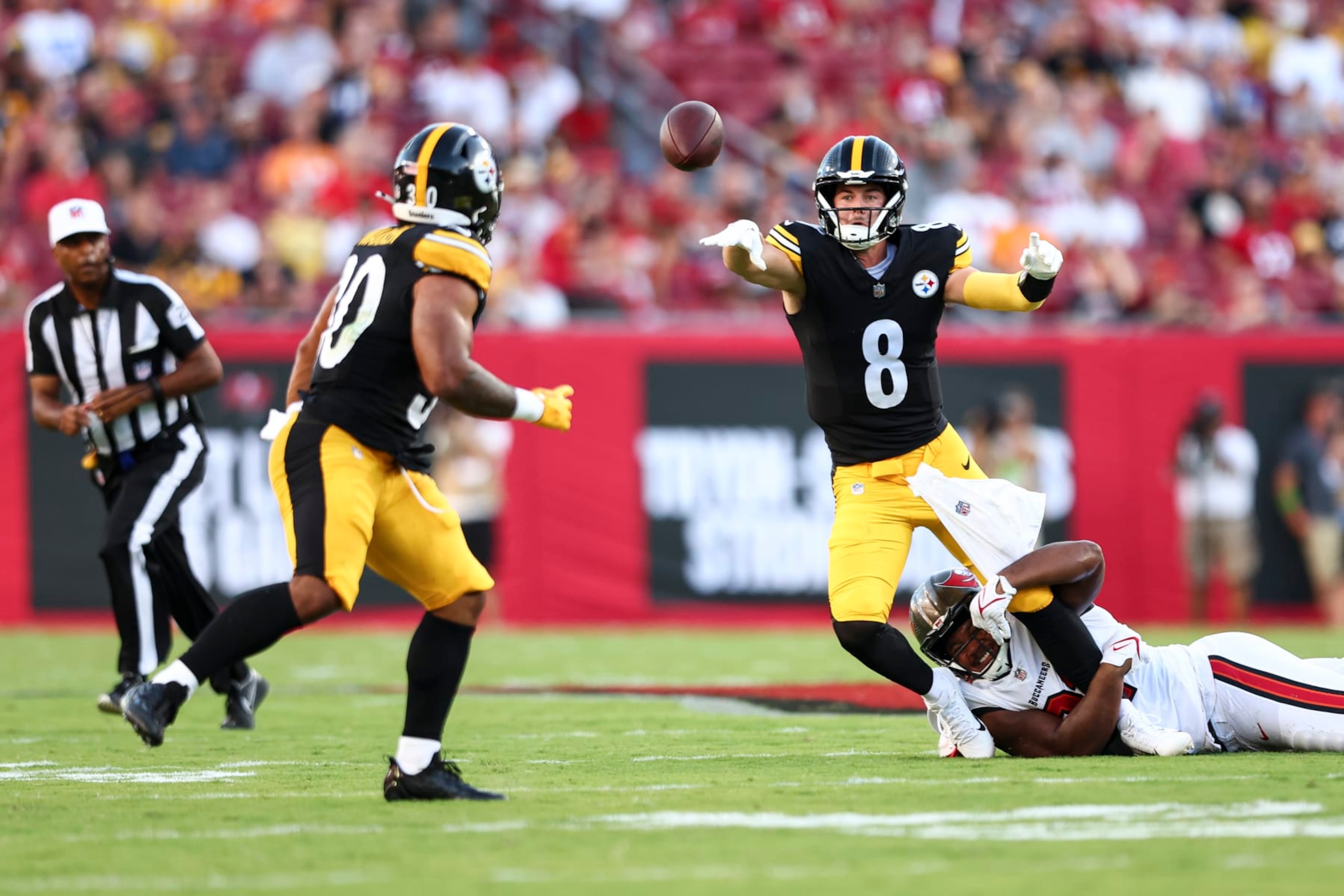 TAMPA, FL - AUGUST 11: Kenny Pickett #8 of the Pittsburgh Steelers avoids a sack by Mike Greene #91 of the Tampa Bay Buccaneers during the first quarter of an NFL preseason football game at Raymond James Stadium on August 11, 2023 in Tampa, Florida. (Photo by Kevin Sabitus/Getty Images) TAMPA, FL - AUGUST 11: Kenny Pickett #8 of the Pittsburgh Steelers avoids a sack by Mike Greene #91 of the Tampa Bay Buccaneers during the first quarter of an NFL preseason football game at Raymond James Stadium on August 11, 2023 in Tampa, Florida. (Photo by Kevin Sabitus/Getty Images)