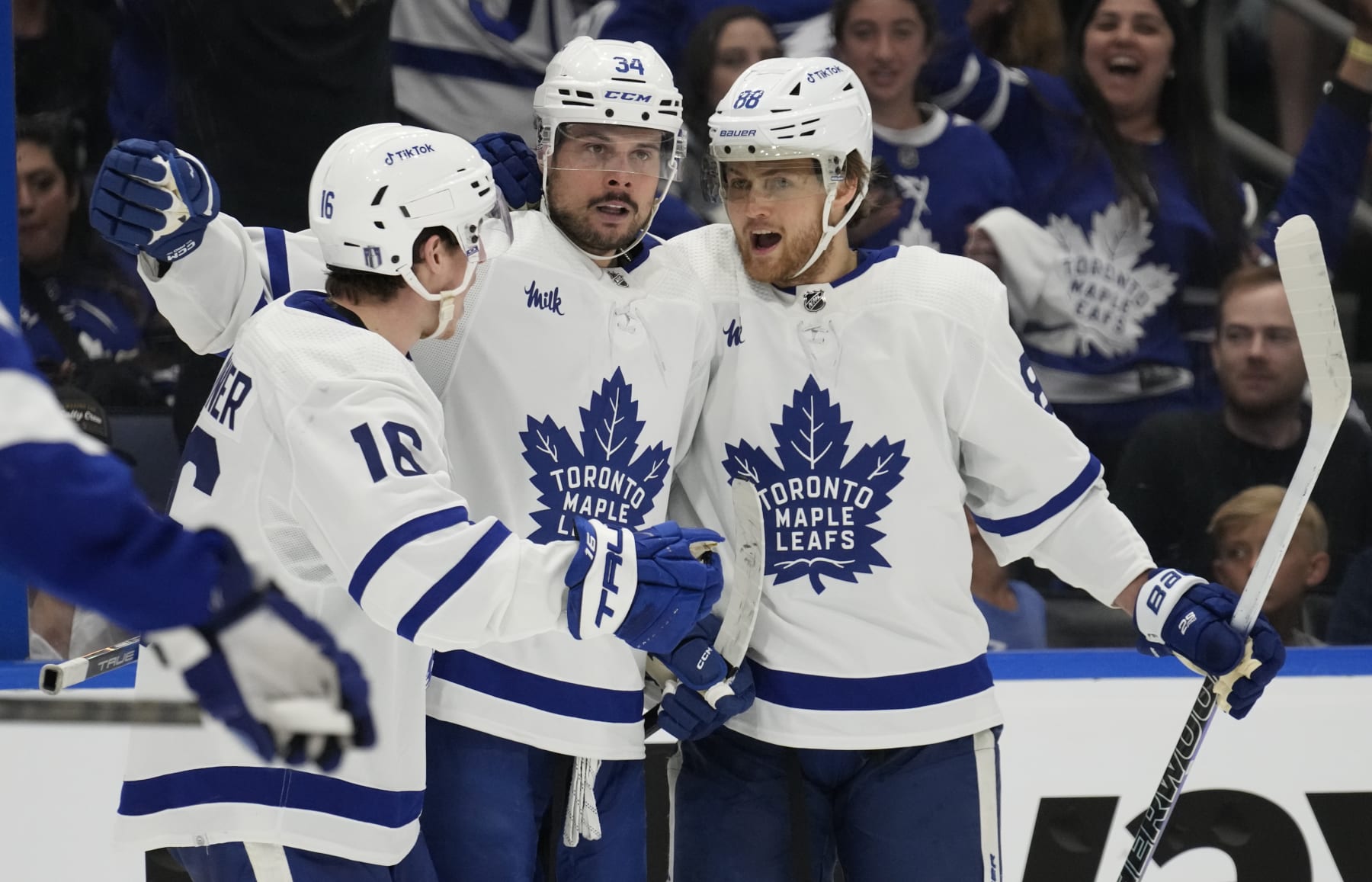 Toronto Maple Leafs center Auston Matthews (34) celebrates his goal against the Tampa Bay Lightning with right wing Mitchell Marner (16) and right wing William Nylander (88) during the third period in Game 4 of an NHL hockey Stanley Cup first-round playoff series Monday, April 24, 2023, in Tampa, Fla. (AP Photo/Chris O'Meara)