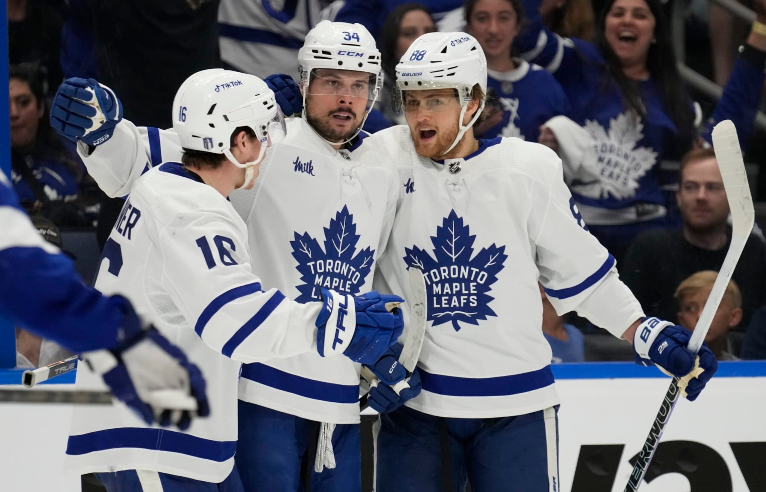 Toronto Maple Leafs center Auston Matthews (34) celebrates his goal against the Tampa Bay Lightning with right wing Mitchell Marner (16) and right wing William Nylander (88) during the third period in Game 4 of an NHL hockey Stanley Cup first-round playoff series Monday, April 24, 2023, in Tampa, Fla. (AP Photo/Chris O'Meara)