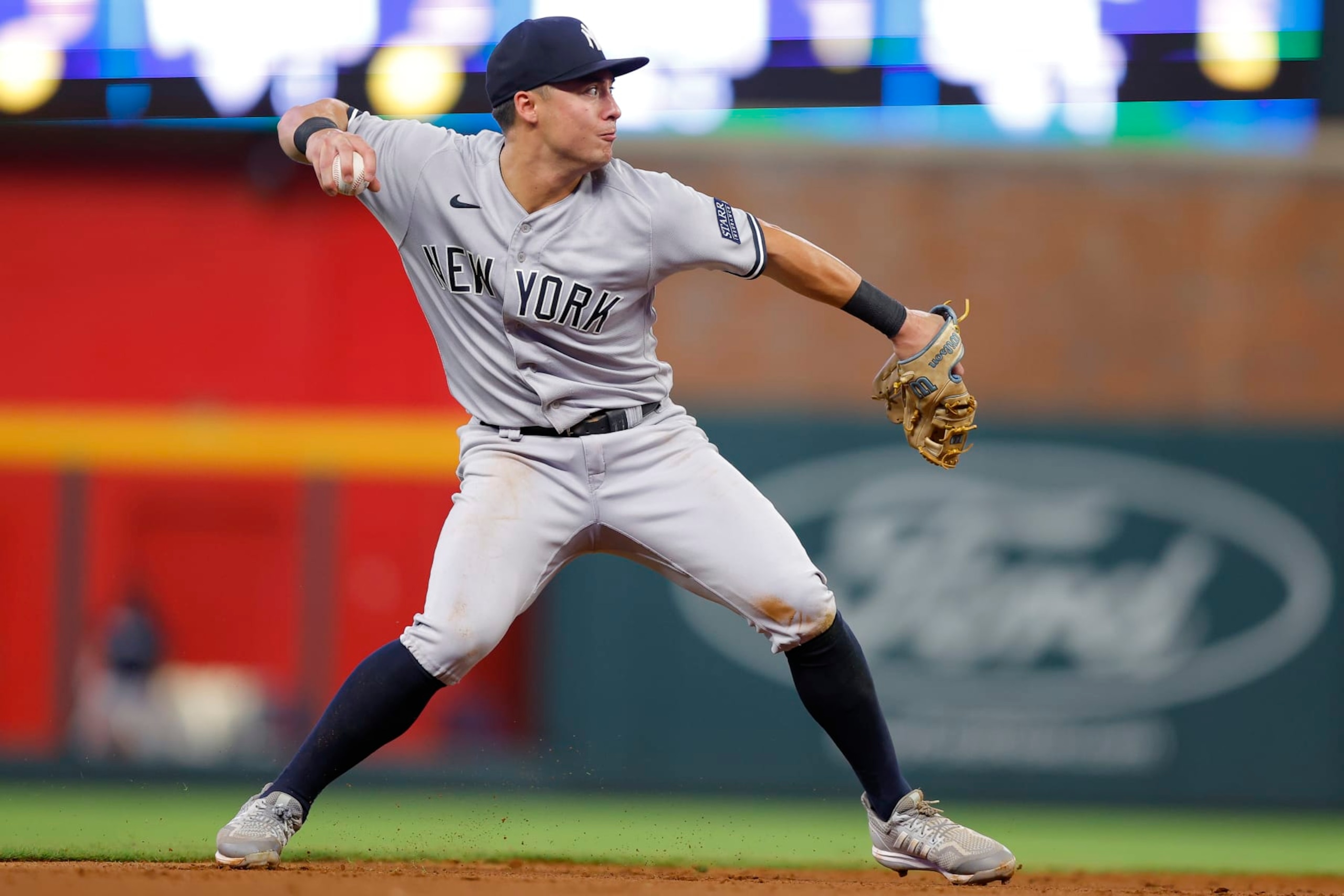 ATLANTA, GEORGIA - AUGUST 15: Anthony Volpe #11 of the New York Yankees throws to first base during the sixth inning against the Atlanta Braves at Truist Park on August 15, 2023 in Atlanta, Georgia. (Photo by Todd Kirkland/Getty Images)