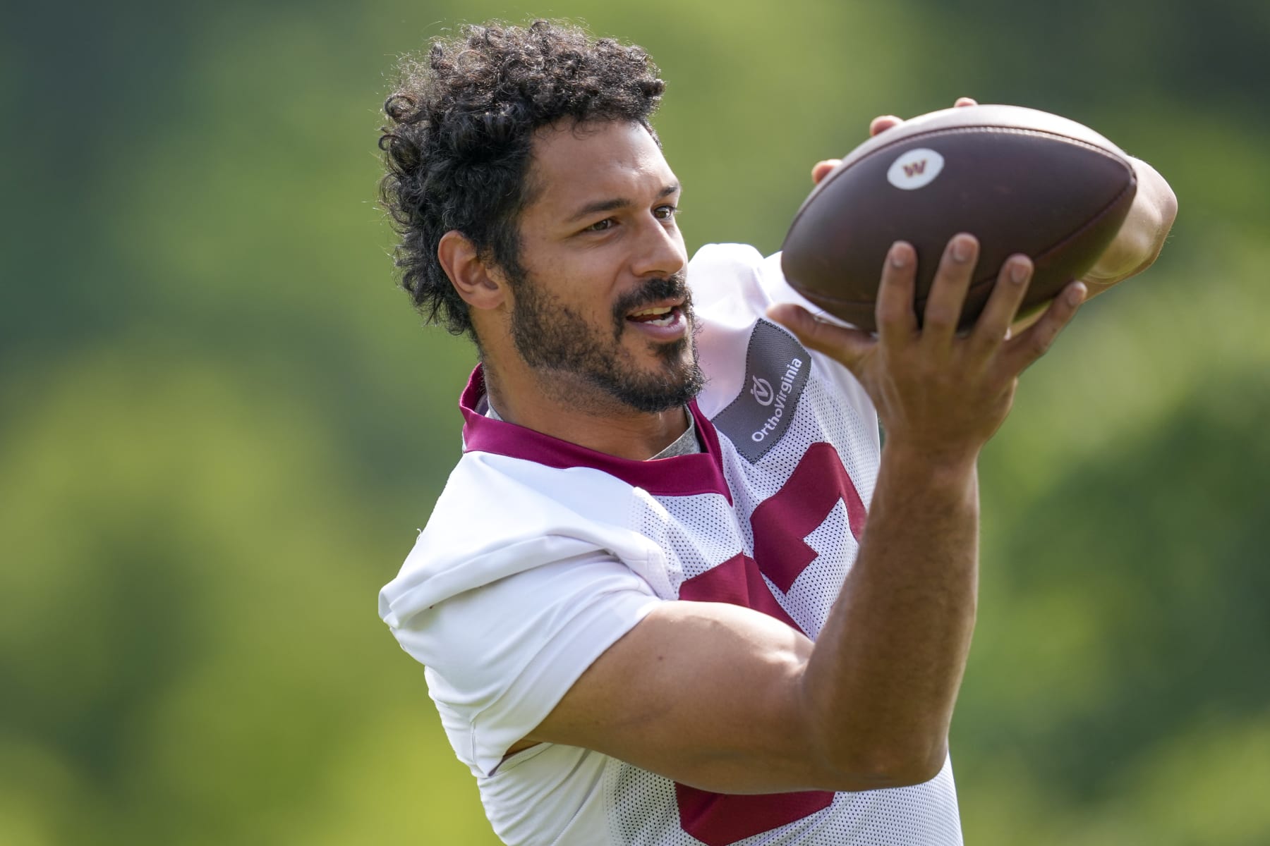 Washington Commanders tight end Logan Thomas (82) catches a pass during practice at the team's NFL football training facility, Wednesday, May 24, 2023 in Ashburn, Va. (AP Photo/Alex Brandon)