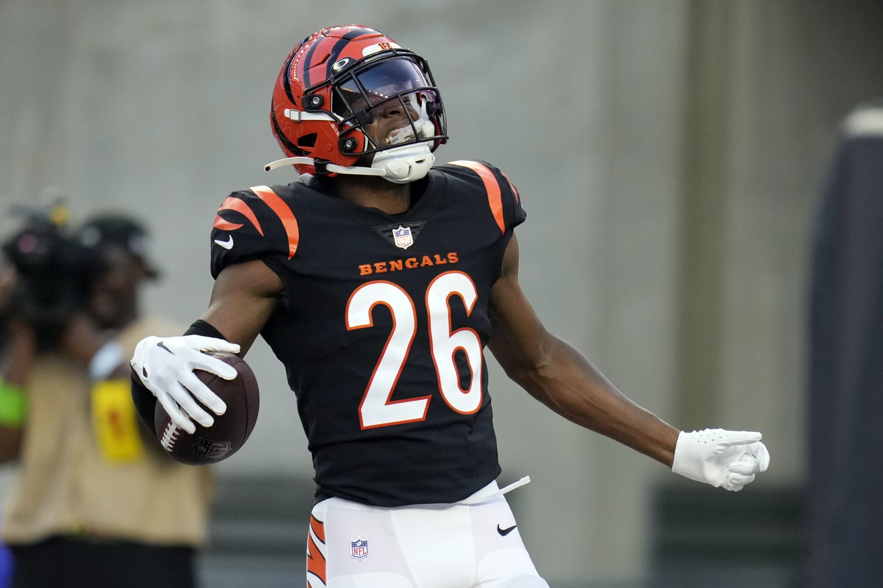 Cincinnati Bengals safety Tycen Anderson (26) celebrates his interception for a touchdown during the first half of a preseason NFL football game against the Green Bay Packers Friday, Aug. 11, 2023, in Cincinnati. (AP Photo/Michael Conroy)