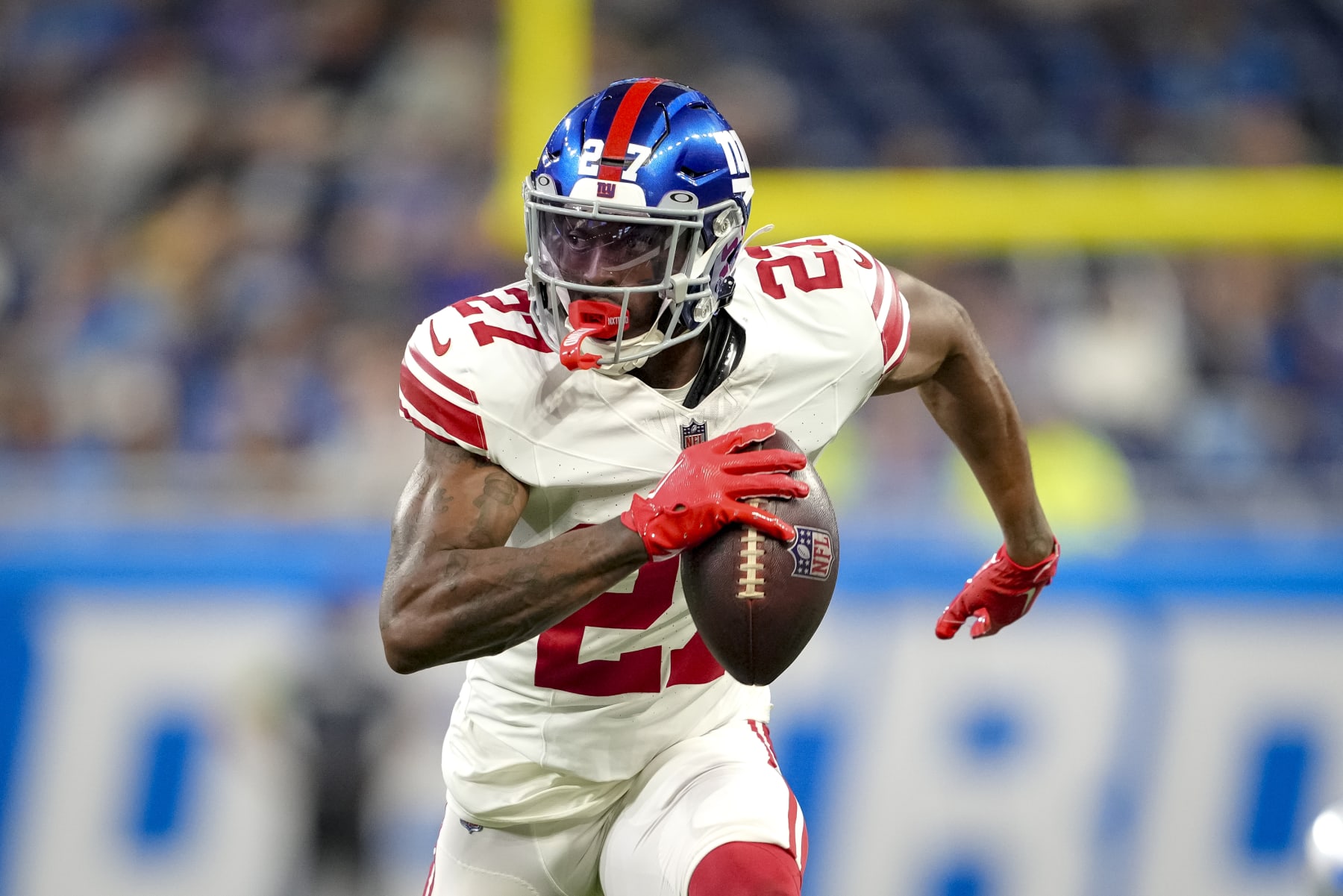 DETROIT, MICHIGAN - AUGUST 11: Jason Pinnock #27 of the New York Giants runs with the ball after an interception against the Detroit Lions during the first quarter of the preseason game at Ford Field on August 11, 2023 in Detroit, Michigan. (Photo by Nic Antaya/Getty Images)