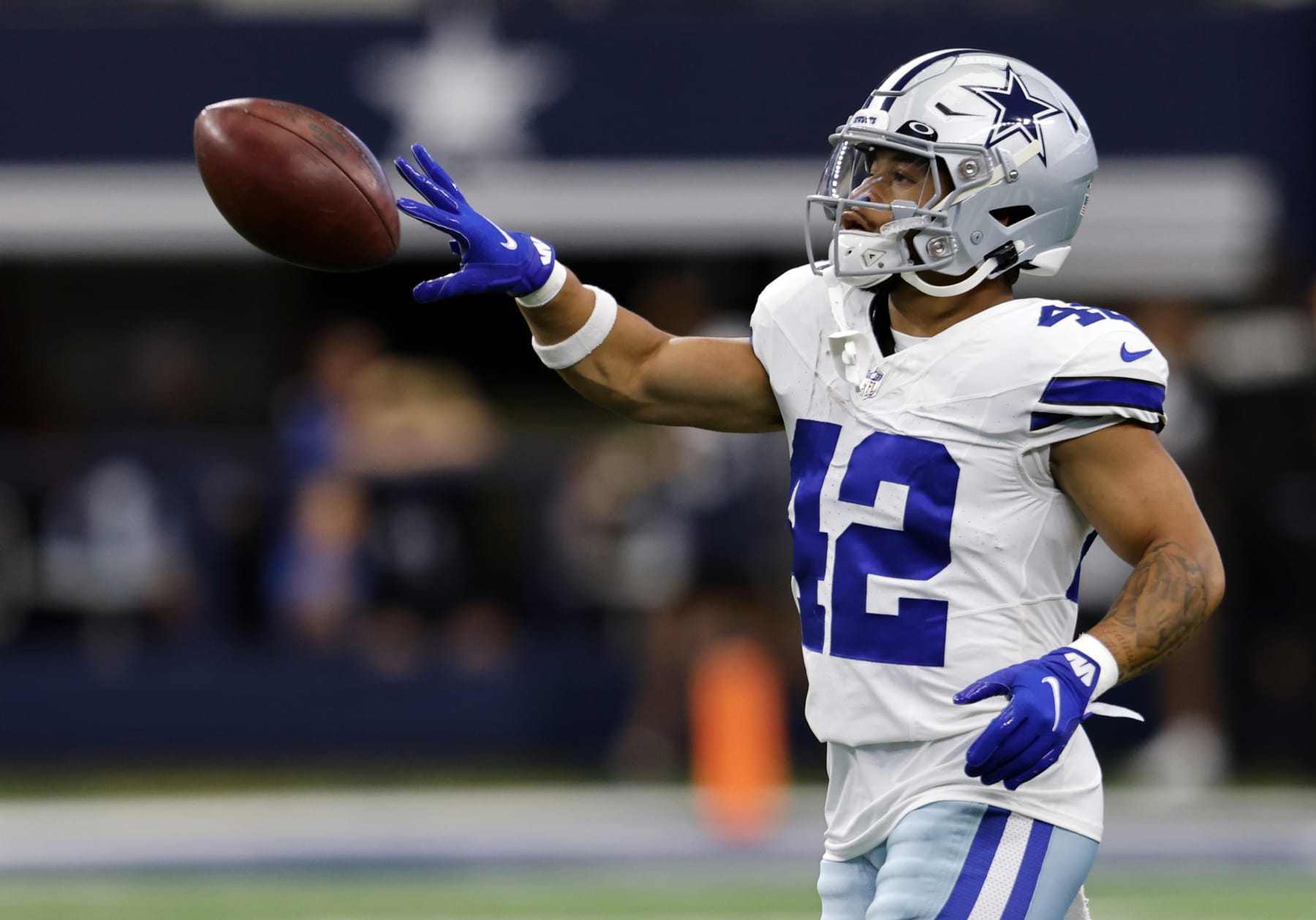 ARLINGTON, TX - AUGUST 12: Deuce Vaughn #42 of the Dallas Cowboys warms up before a preseason game  against the Jacksonville Jaguars at AT&T Stadium on August 12, 2023 in Arlington, Texas. (Photo by Ron Jenkins/Getty Images)