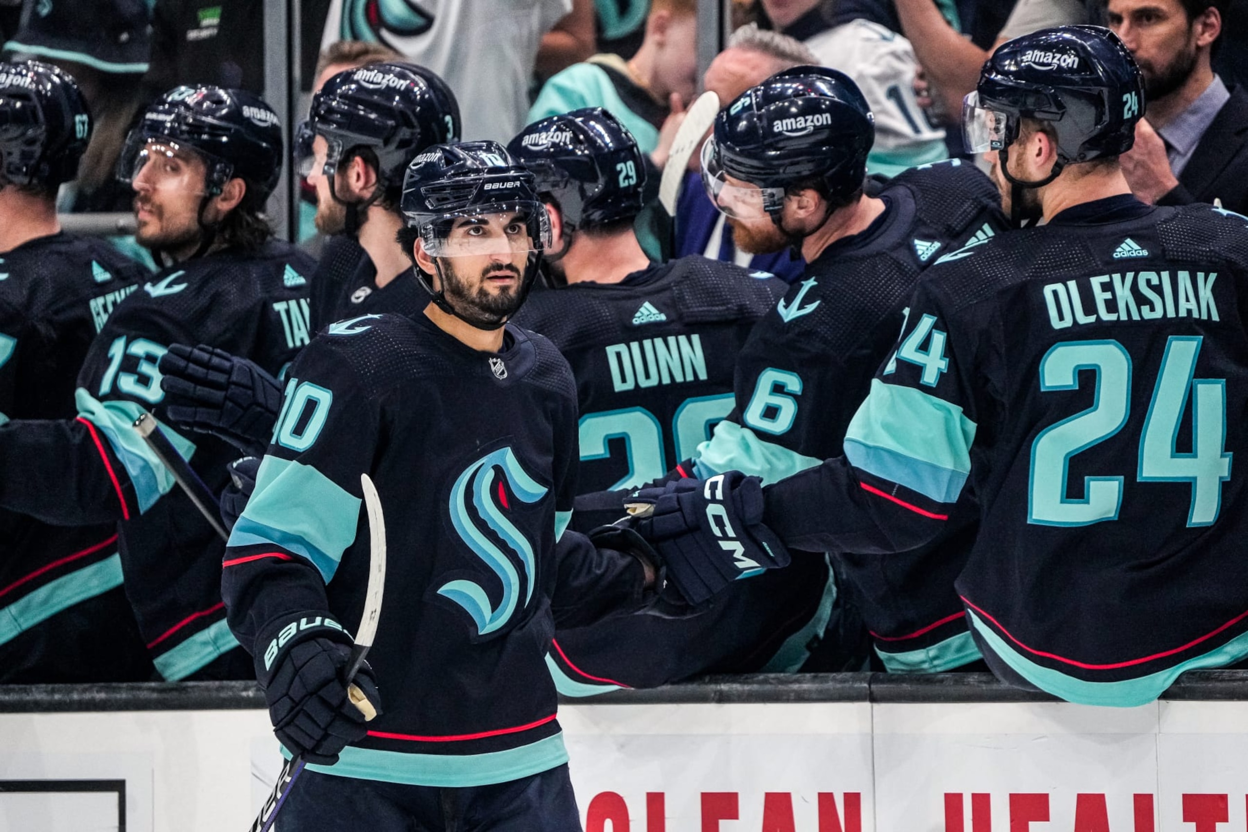 SEATTLE, WASHINGTON - MAY 7: Matty Beniers #10 of the Seattle Kraken celebrates his goal with the bench during the second period against the Dallas Stars in Game Three of the Second Round of the 2023 Stanley Cup Playoffs at Climate Pledge Arena on May 7, 2023 in Seattle, Washington. (Photo by Christopher Mast/NHLI via Getty Images)
