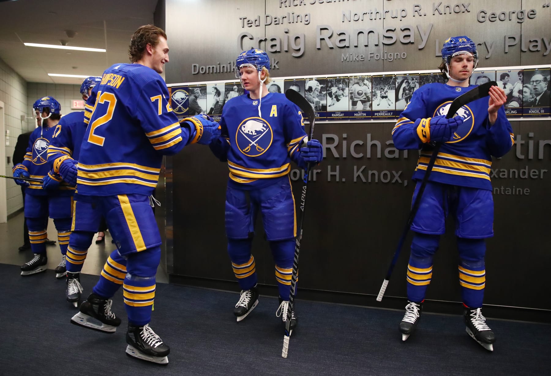 BUFFALO, NY - APRIL 14:  Tage Thompson #72, Rasmus Dahlin #26 and Owen Power #25 of the Buffalo Sabres prepare before an NHL game against the St. Louis Blues on April 14, 2022 at KeyBank Center in Buffalo, New York. St. Louis won, 6-2. (Photo by Bill Wippert/NHLI via Getty Images)