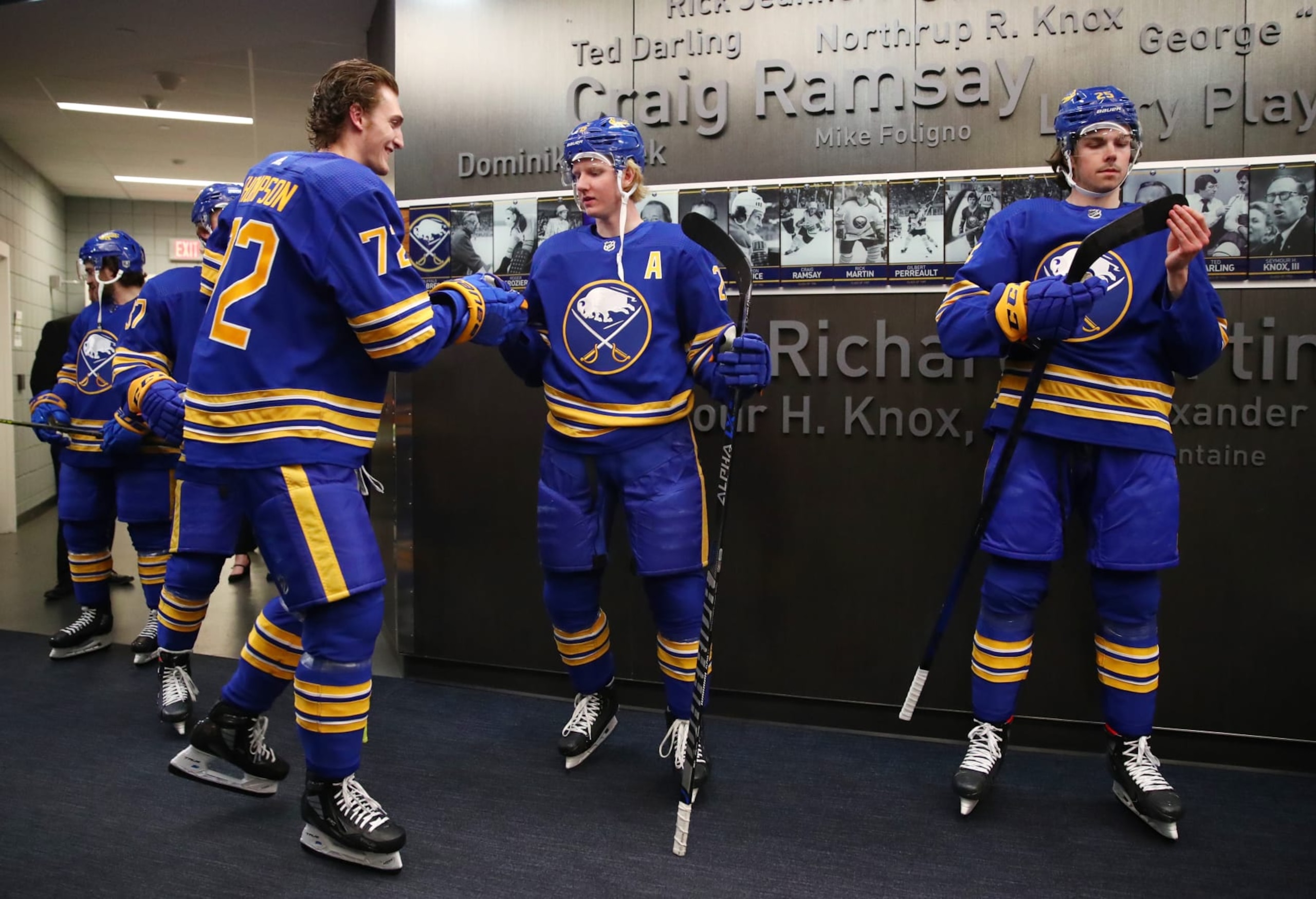 BUFFALO, NY - APRIL 14:  Tage Thompson #72, Rasmus Dahlin #26 and Owen Power #25 of the Buffalo Sabres prepare before an NHL game against the St. Louis Blues on April 14, 2022 at KeyBank Center in Buffalo, New York. St. Louis won, 6-2. (Photo by Bill Wippert/NHLI via Getty Images)