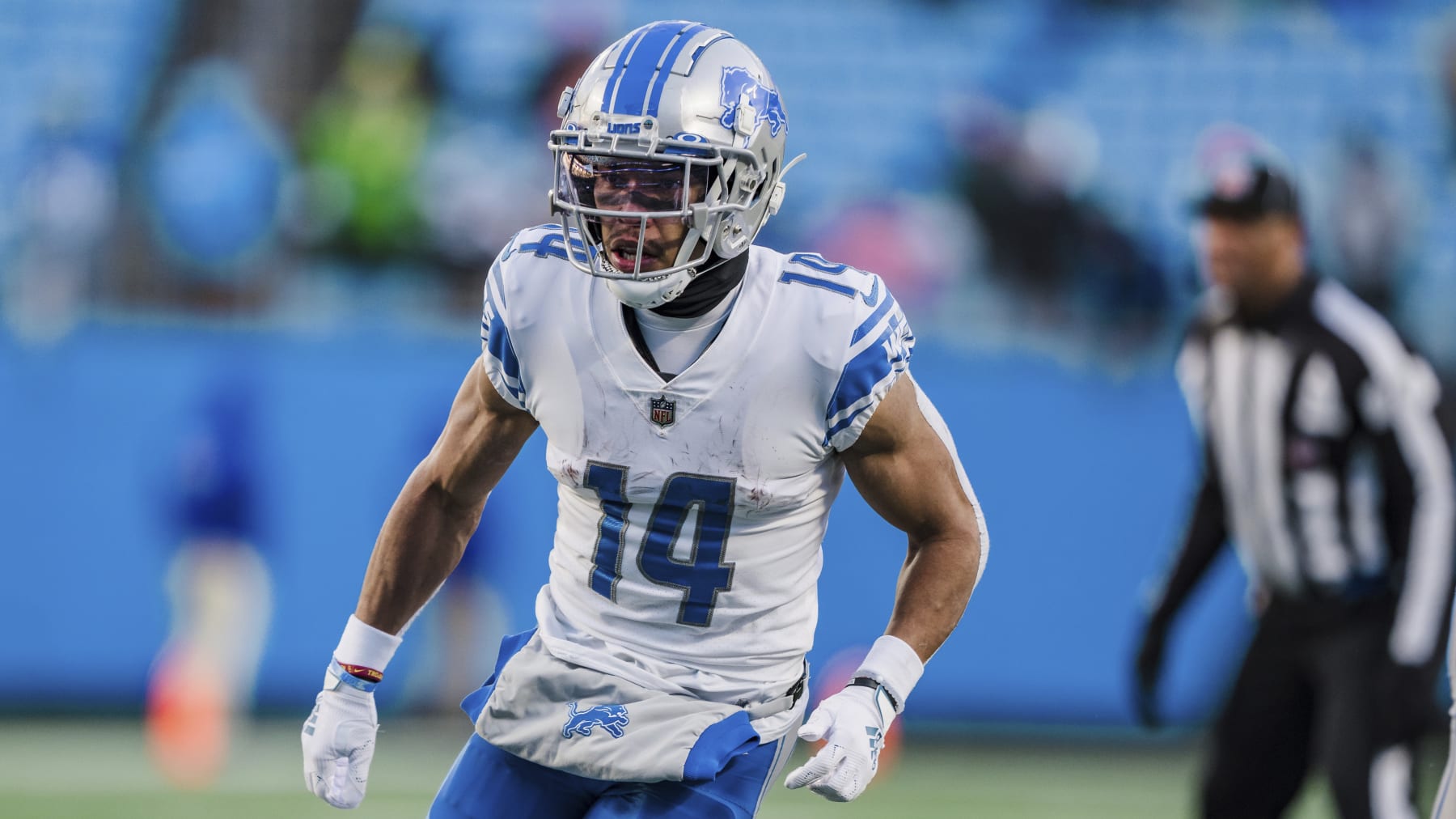 Detroit Lions wide receiver Amon-Ra St. Brown (14) runs during an NFL football game between the Carolina Panthers and the Detroit Lions on Saturday, Dec. 24, 2022, in Charlotte, N.C. (AP Photo/Jacob Kupferman)