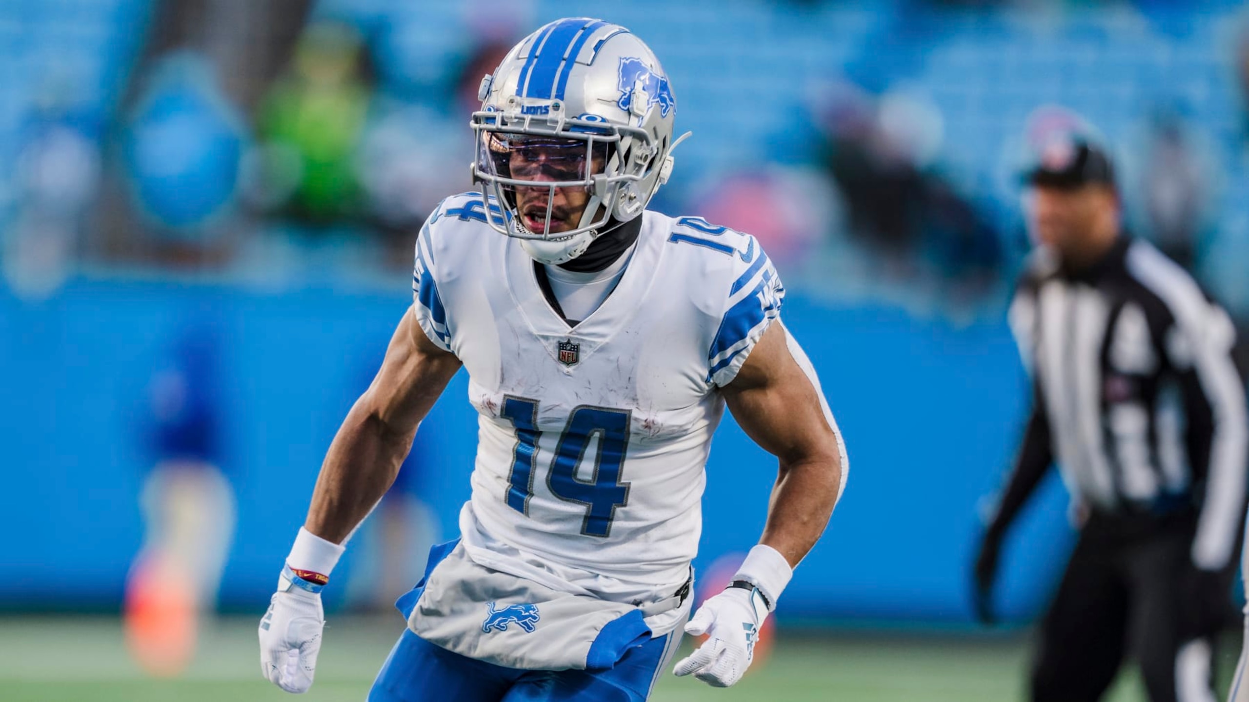 Detroit Lions wide receiver Amon-Ra St. Brown (14) runs during an NFL football game between the Carolina Panthers and the Detroit Lions on Saturday, Dec. 24, 2022, in Charlotte, N.C. (AP Photo/Jacob Kupferman)