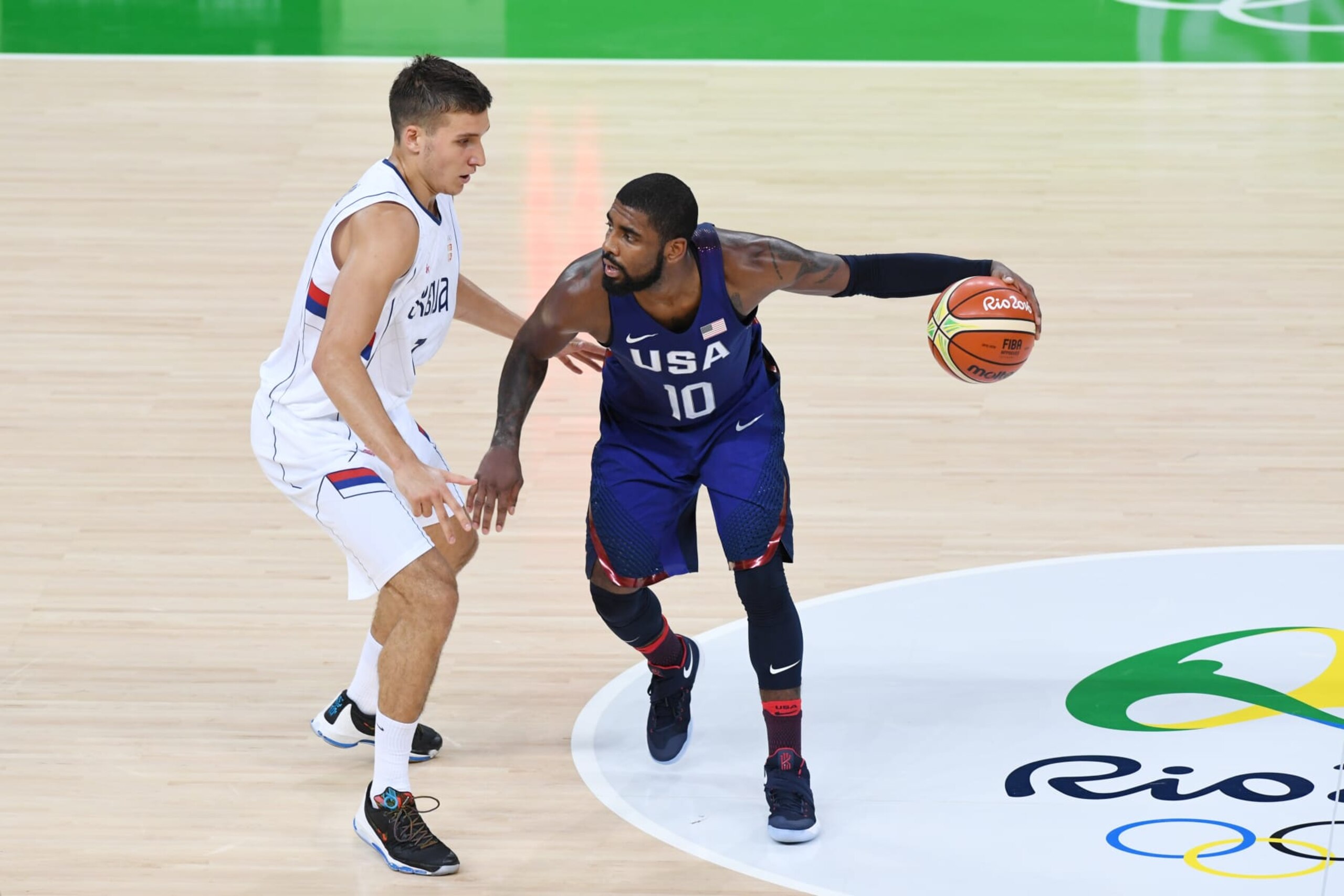 RIO DE JANEIRO, BRAZIL - AUGUST 21:  Kyrie Irving #10 of the USA Basketball Men's National Team handles the ball against Serbia during the Gold Medal Game on Day 16 of the Rio 2016 Olympic Games at Carioca Arena 1 on August 21, 2016 in Rio de Janeiro, Brazil. NOTE TO USER: User expressly acknowledges and agrees that, by downloading and/or using this Photograph, user is consenting to the terms and conditions of the Getty Images License Agreement. Mandatory Copyright Notice: Copyright 2016 NBAE (Photo by Garrett Ellwood/NBAE via Getty Images)