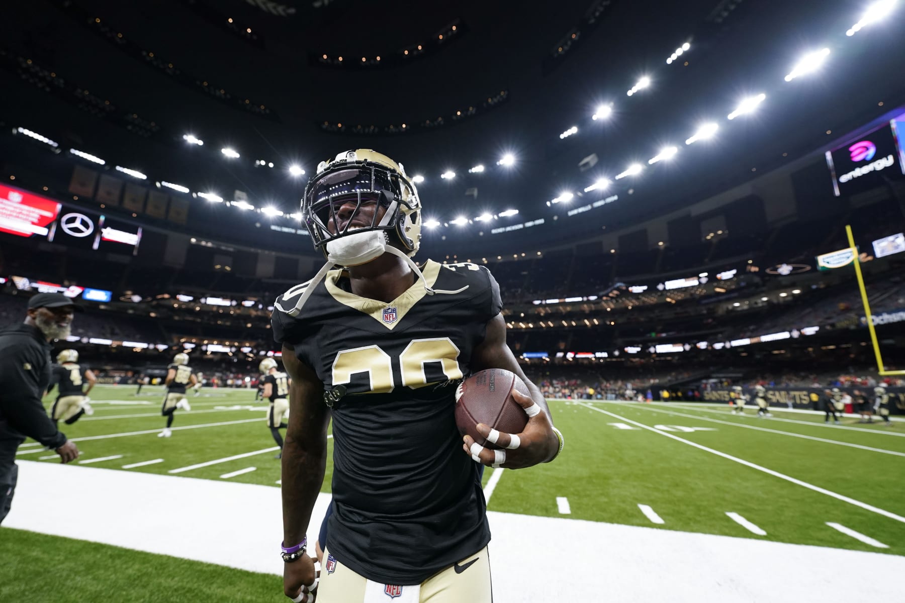 New Orleans Saints running back Jamaal Williams (30) talks to fans on the sideline before an NFL football game against the Kansas City Chiefs in New Orleans, Sunday, Aug. 13, 2023. (AP Photo/Gerald Herbert)