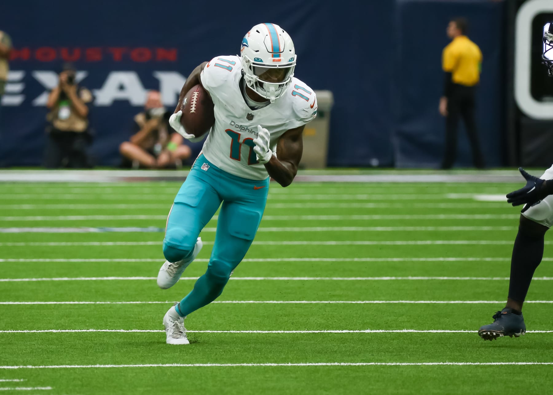 HOUSTON, TX - AUGUST 19:  Miami Dolphins wide receiver Cedrick Wilson Jr. (11) carries the ball in the second quarter during the preseason NFL game between the Miami Dolphins and Houston Texans on August 19, 2023 at NRG Stadium in Houston, Texas.  (Photo by Leslie Plaza Johnson/Icon Sportswire via Getty Images)
