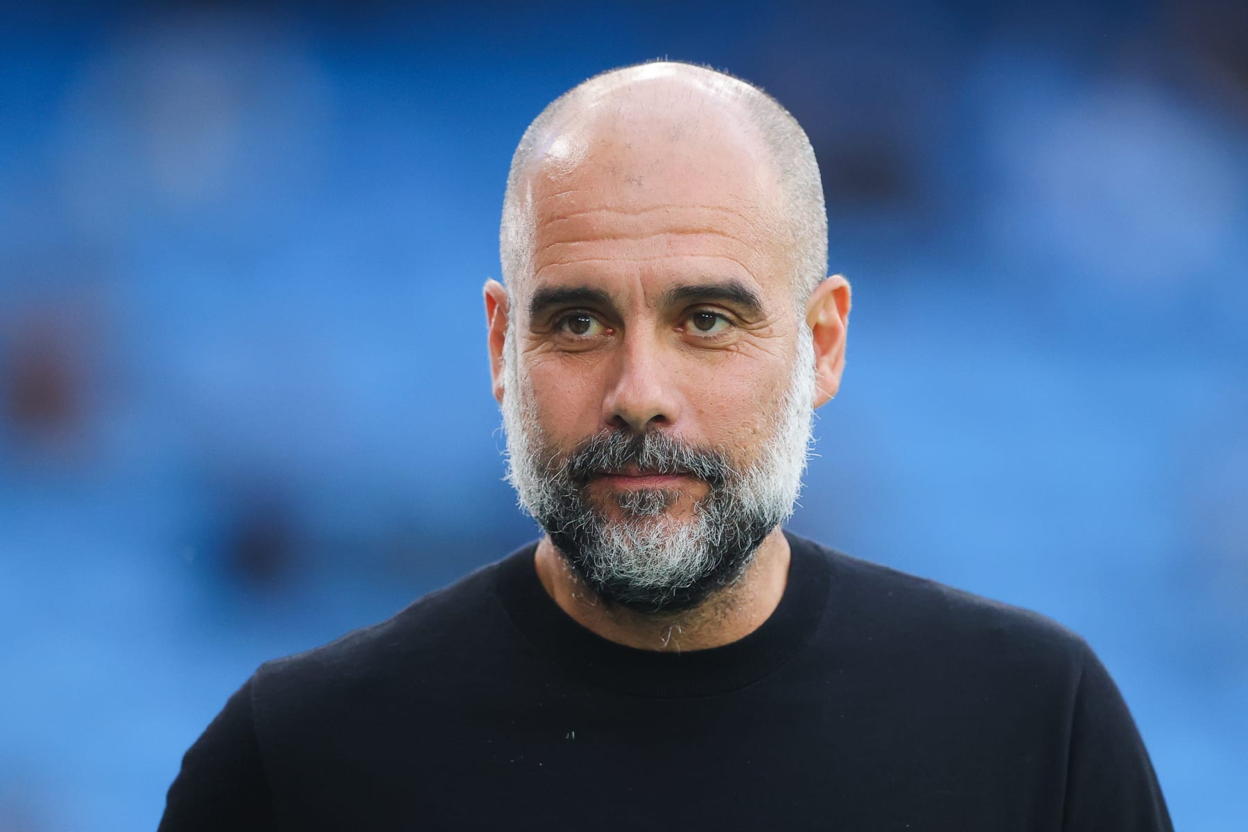 MANCHESTER, ENGLAND - AUGUST 19: Josep 'Pep' Guardiola, manager of Manchester City, looks on prior to the Premier League match between Manchester City and Newcastle United at Etihad Stadium on August 19, 2023 in Manchester, England. (Photo by James Gill - Danehouse/Getty Images)