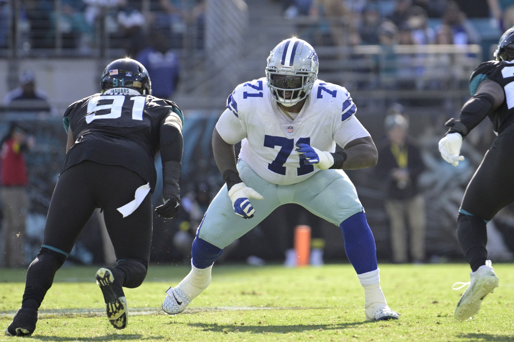 Dallas Cowboys offensive tackle Jason Peters (71) sets up to block in front of Jacksonville Jaguars defensive end Dawuane Smoot (91) during the second half of an NFL football game, Sunday, Dec. 18, 2022, in Jacksonville, Fla. (AP Photo/Phelan M. Ebenhack)
