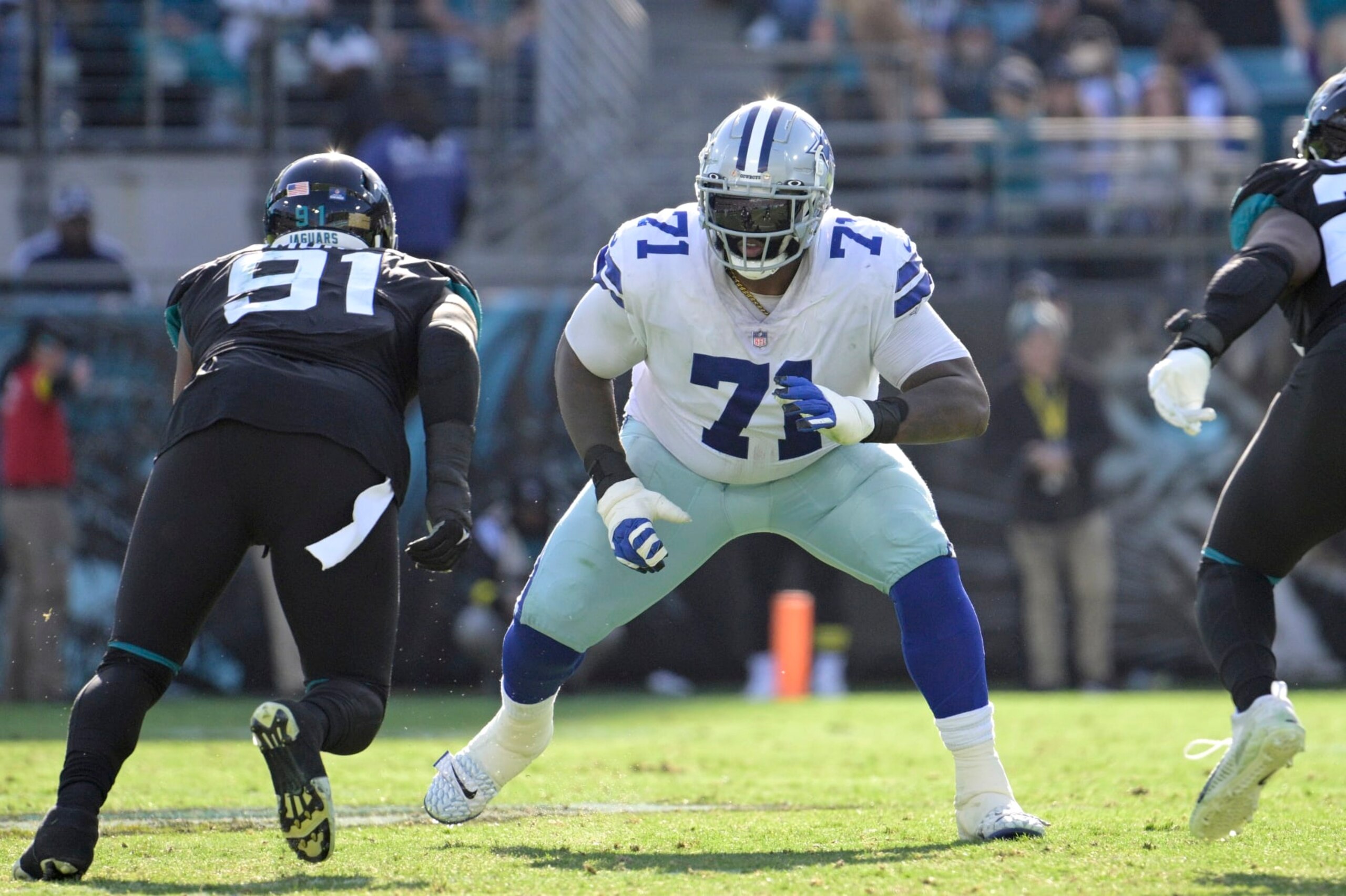 Dallas Cowboys offensive tackle Jason Peters (71) sets up to block in front of Jacksonville Jaguars defensive end Dawuane Smoot (91) during the second half of an NFL football game, Sunday, Dec. 18, 2022, in Jacksonville, Fla. (AP Photo/Phelan M. Ebenhack)