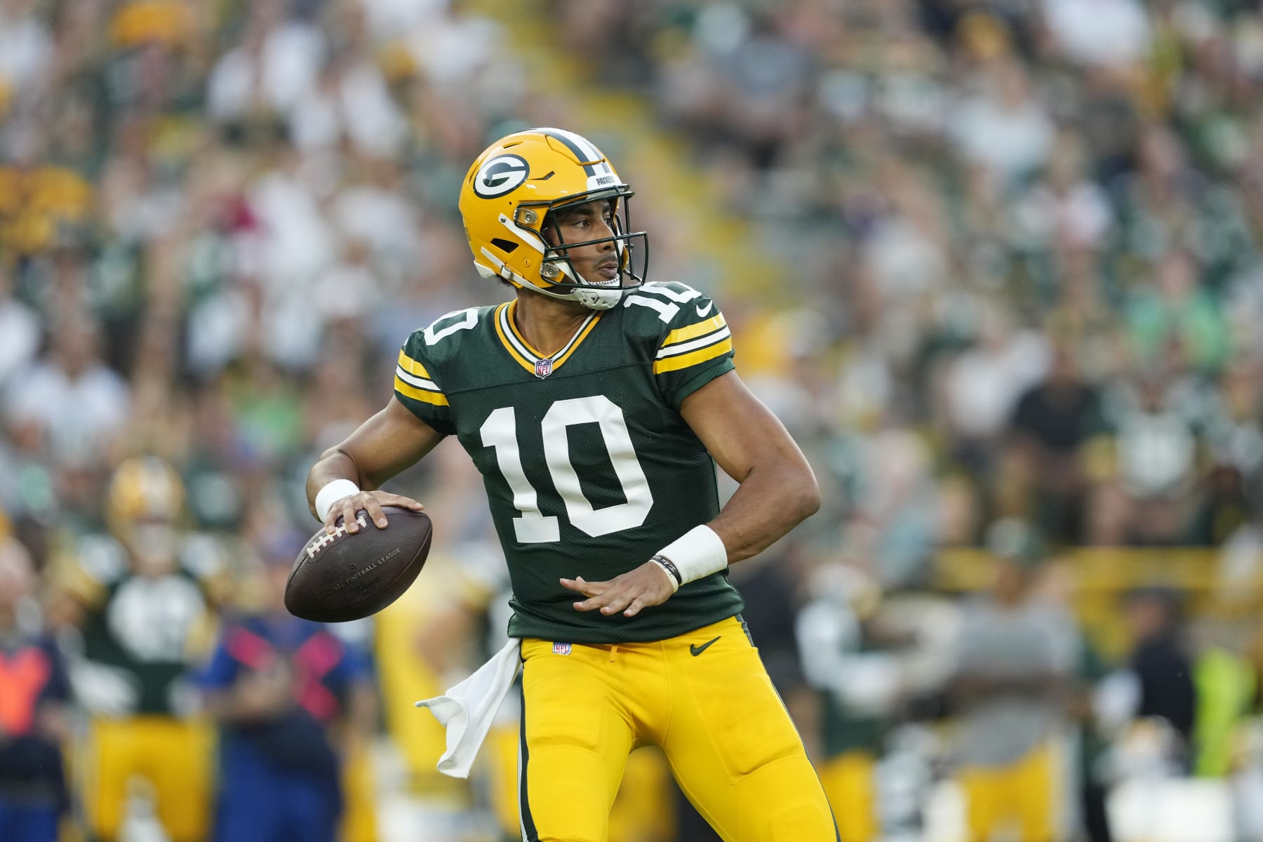 GREEN BAY, WISCONSIN - AUGUST 19: Jordan Love #10 of the Green Bay Packers looks to throw a pass in the first quarter against the New England Patriots during a preseason game at Lambeau Field on August 19, 2023 in Green Bay, Wisconsin. (Photo by Patrick McDermott/Getty Images)