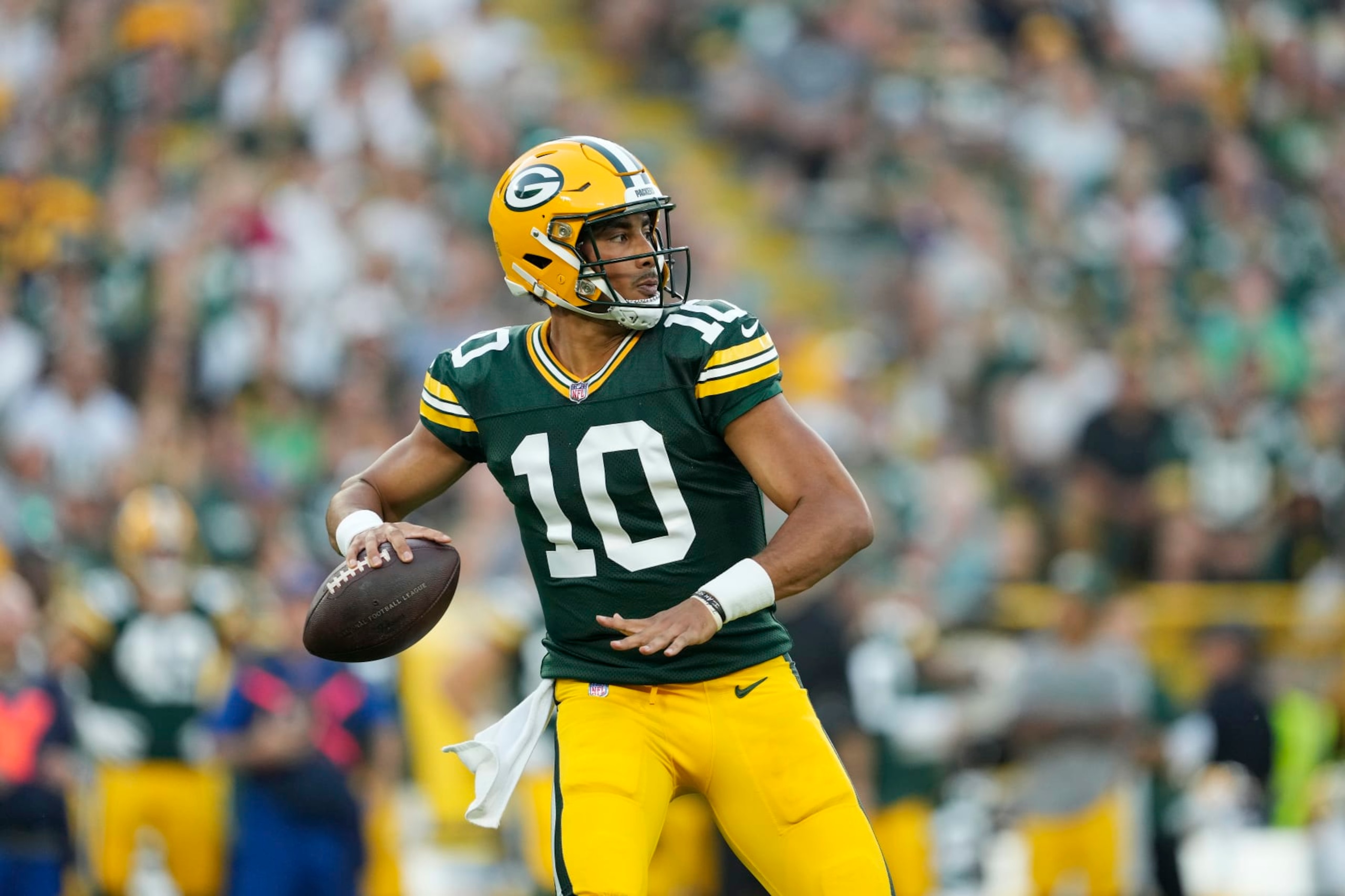 GREEN BAY, WISCONSIN - AUGUST 19: Jordan Love #10 of the Green Bay Packers looks to throw a pass in the first quarter against the New England Patriots during a preseason game at Lambeau Field on August 19, 2023 in Green Bay, Wisconsin. (Photo by Patrick McDermott/Getty Images)