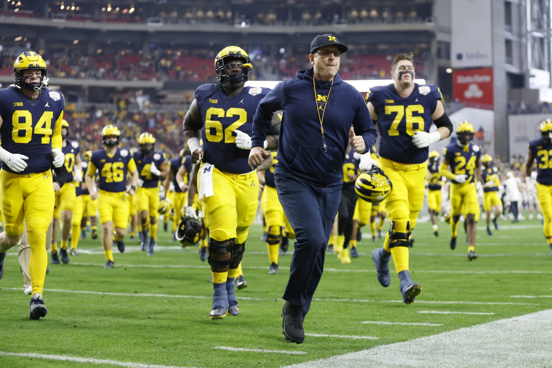 GLENDALE, ARIZONA - DECEMBER 31: The Michigan Wolverines return to the locker room after warmups prior to the game against the TCU Horned Frogs in the Vrbo Fiesta Bowl at State Farm Stadium on December 31, 2022 in Glendale, Arizona. (Photo by Chris Coduto/Getty Images)