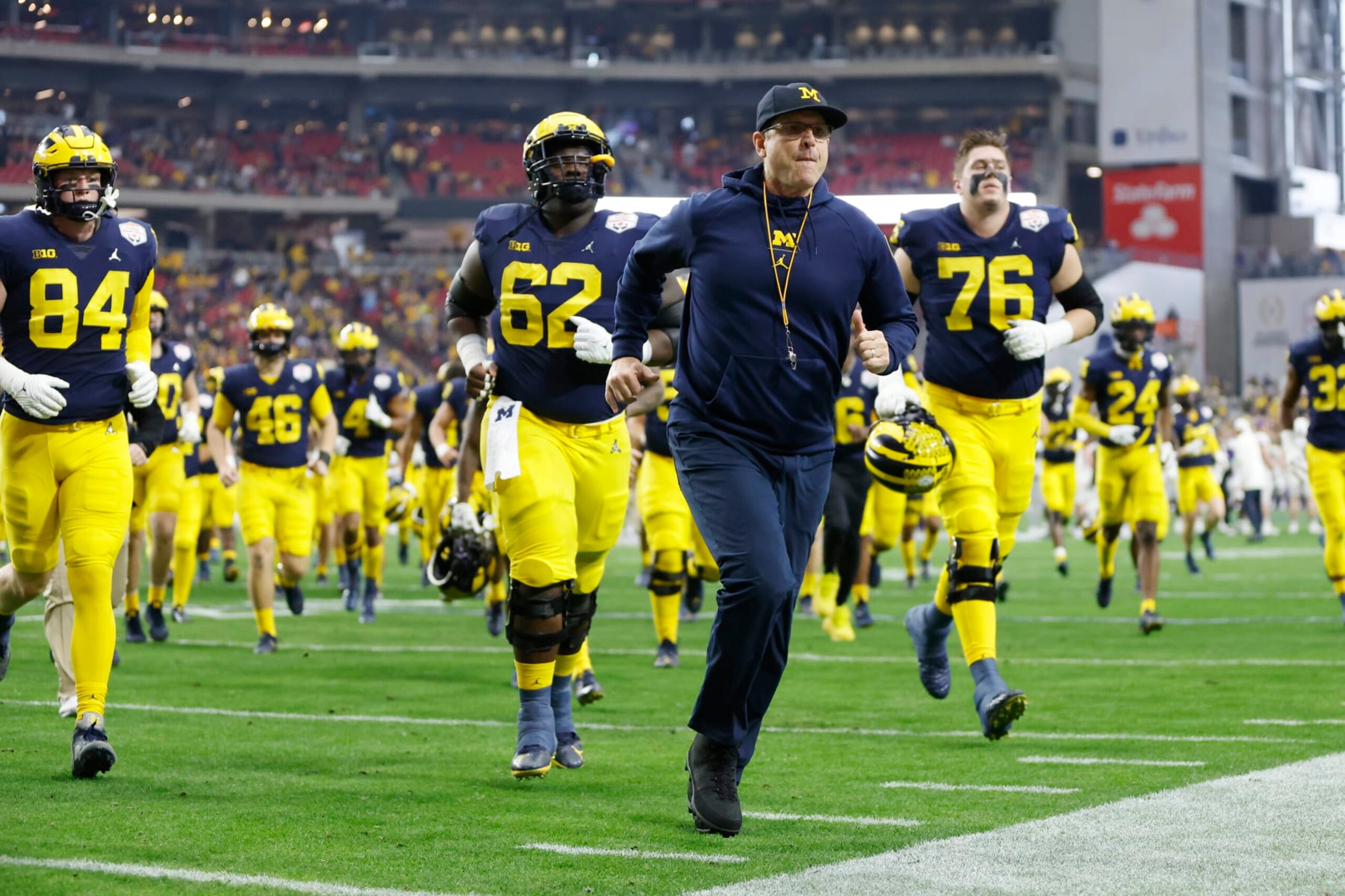 GLENDALE, ARIZONA - DECEMBER 31: The Michigan Wolverines return to the locker room after warmups prior to the game against the TCU Horned Frogs in the Vrbo Fiesta Bowl at State Farm Stadium on December 31, 2022 in Glendale, Arizona. (Photo by Chris Coduto/Getty Images)