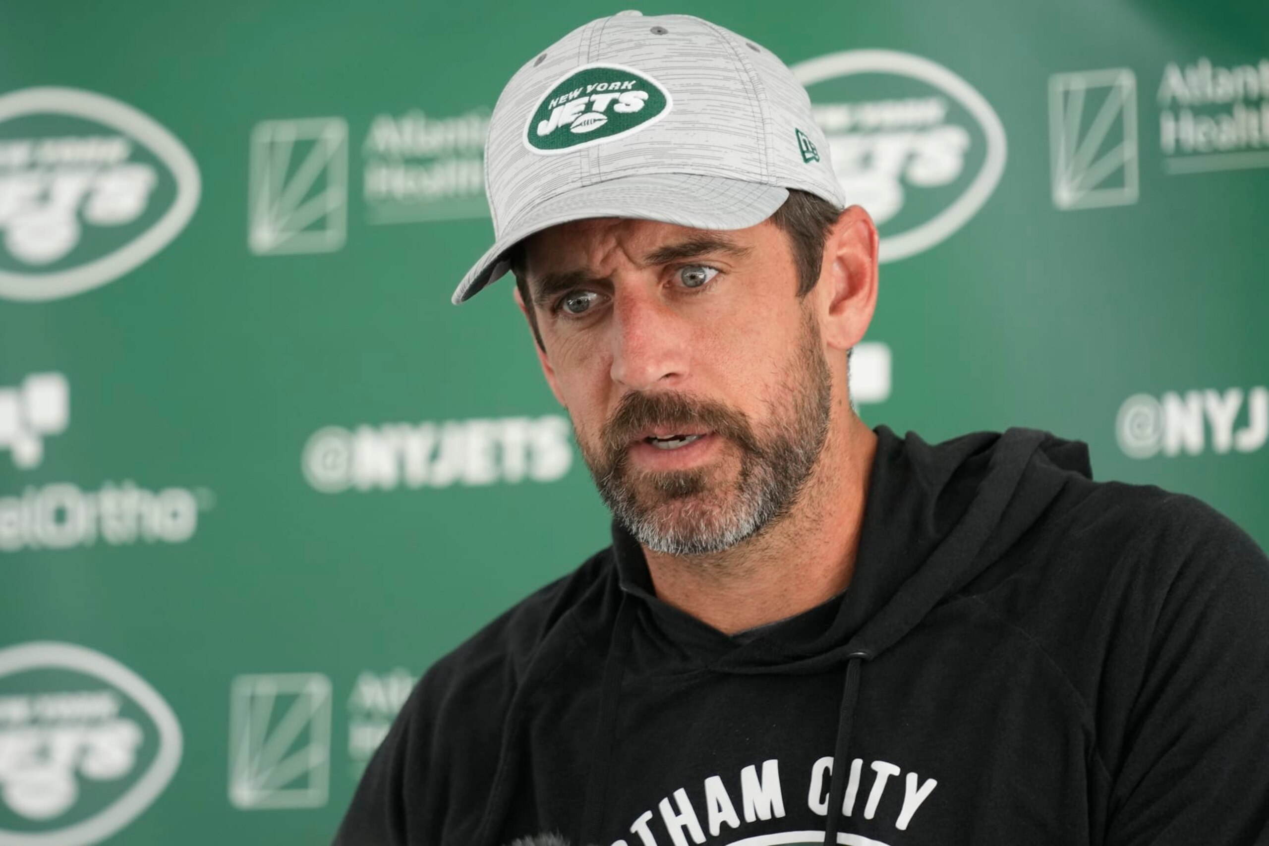 New York Jets quarterback Aaron Rodgers talks to reporters after a joint practice with the Tampa Bay Buccaneers at the Jets' training facility in Florham Park, N.J., Wednesday, Aug. 16, 2023. (AP Photo/Seth Wenig)
