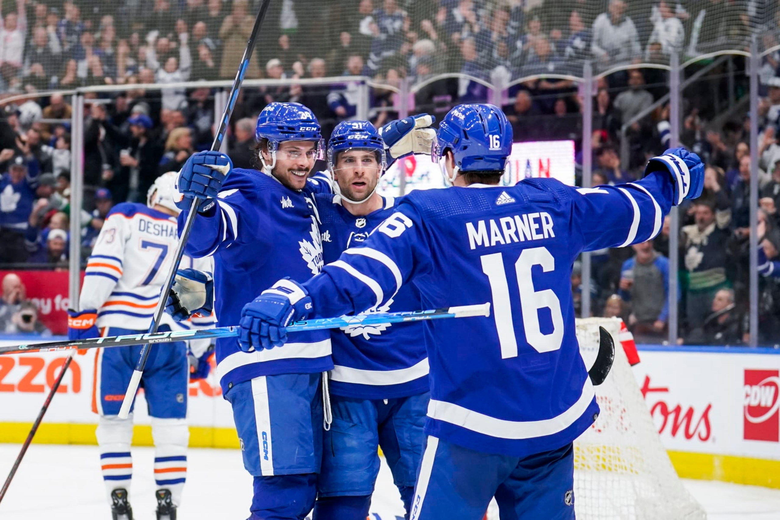 TORONTO, ON - MARCH 11: Auston Matthews #34 of the Toronto Maple Leafs celebrates his goal against the Edmonton Oilers with teammates John Tavares #91 and Mitchell Marner #16 during the third period at the Scotiabank Arena on March 11, 2023 in Toronto, Ontario, Canada. (Photo by Andrew Lahodynskyj/NHLI via Getty Images)