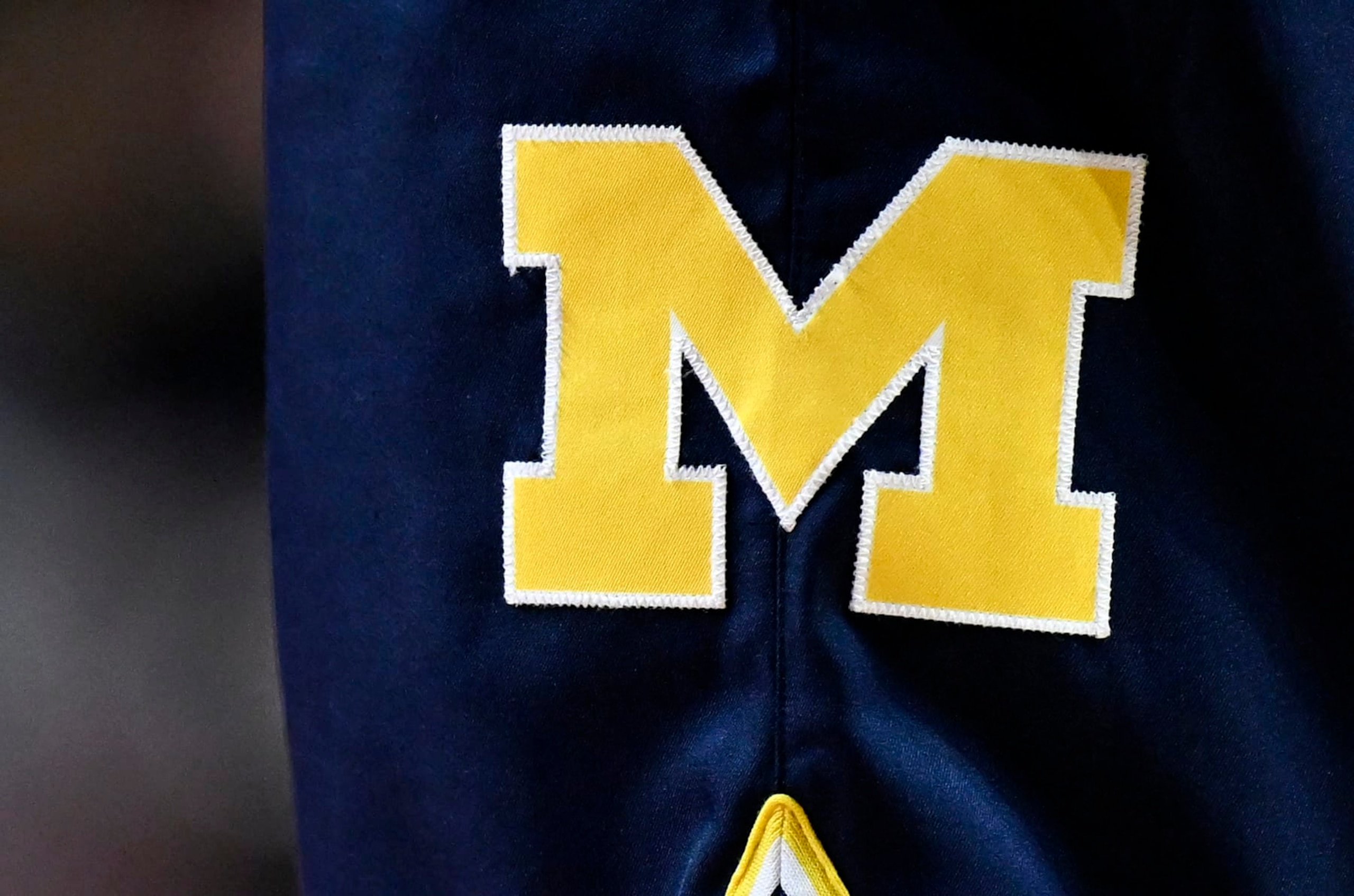 COLLEGE PARK, MARYLAND - JANUARY 19: A view of the Michigan Wolverines logo on their uniform during the game against the Maryland Terrapins at Xfinity Center on January 19, 2023 in College Park, Maryland. (Photo by G Fiume/Getty Images)