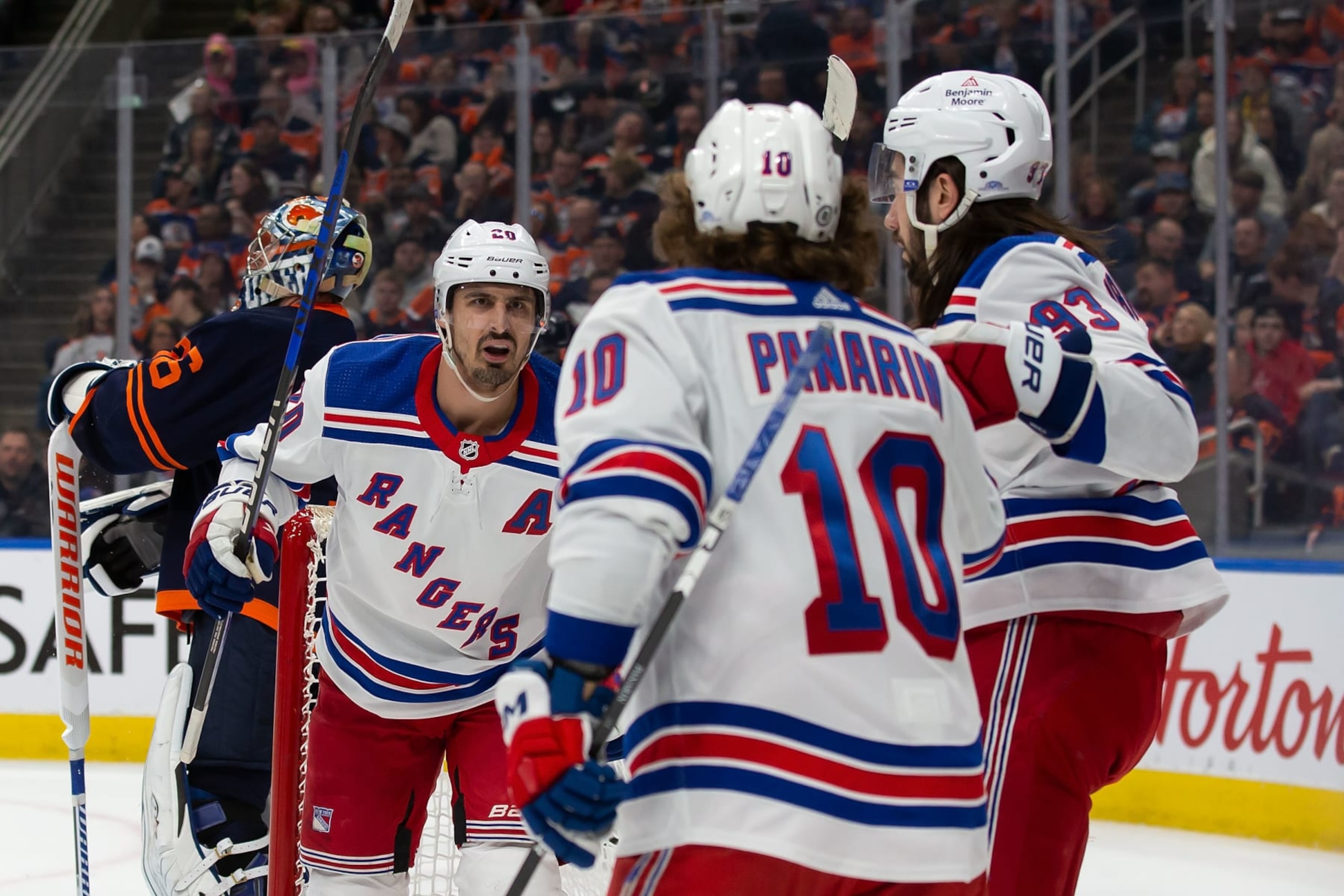 EDMONTON, AB - FEBRUARY 17: Chris Kreider #20, Artemi Panarin #10 and Mika Zibanejad #93 of the New York Rangers celebrate Kreider's goal against the Edmonton Oilers during the first period of the game at Rogers Place on February 17, 2023 in Edmonton, Canada. (Photo by Codie McLachlan/Getty Images)