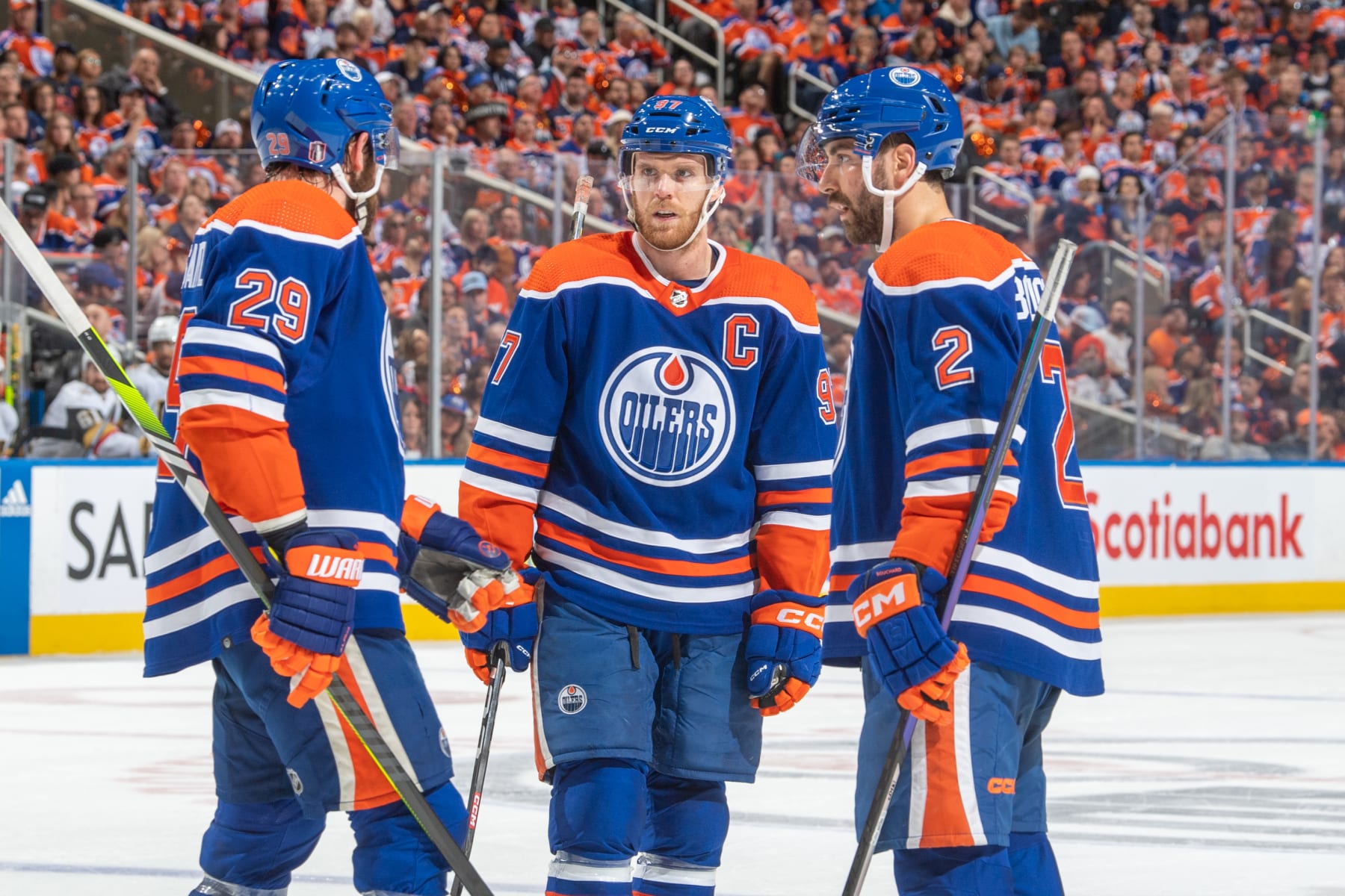 EDMONTON, CANADA - MAY 14 Connor McDavid #97, Leon Draisaitl #29 and Evan Bouchard #2 of the Edmonton Oilers have a discussion during a stoppage in play in Game Six of the Second Round of the 2023 Stanley Cup Playoffs against the Vegas Golden Knights at Rogers Place on May 14, 2023, in Edmonton, Alberta, Canada. (Photo by Andy Devlin/NHLI via Getty Images)