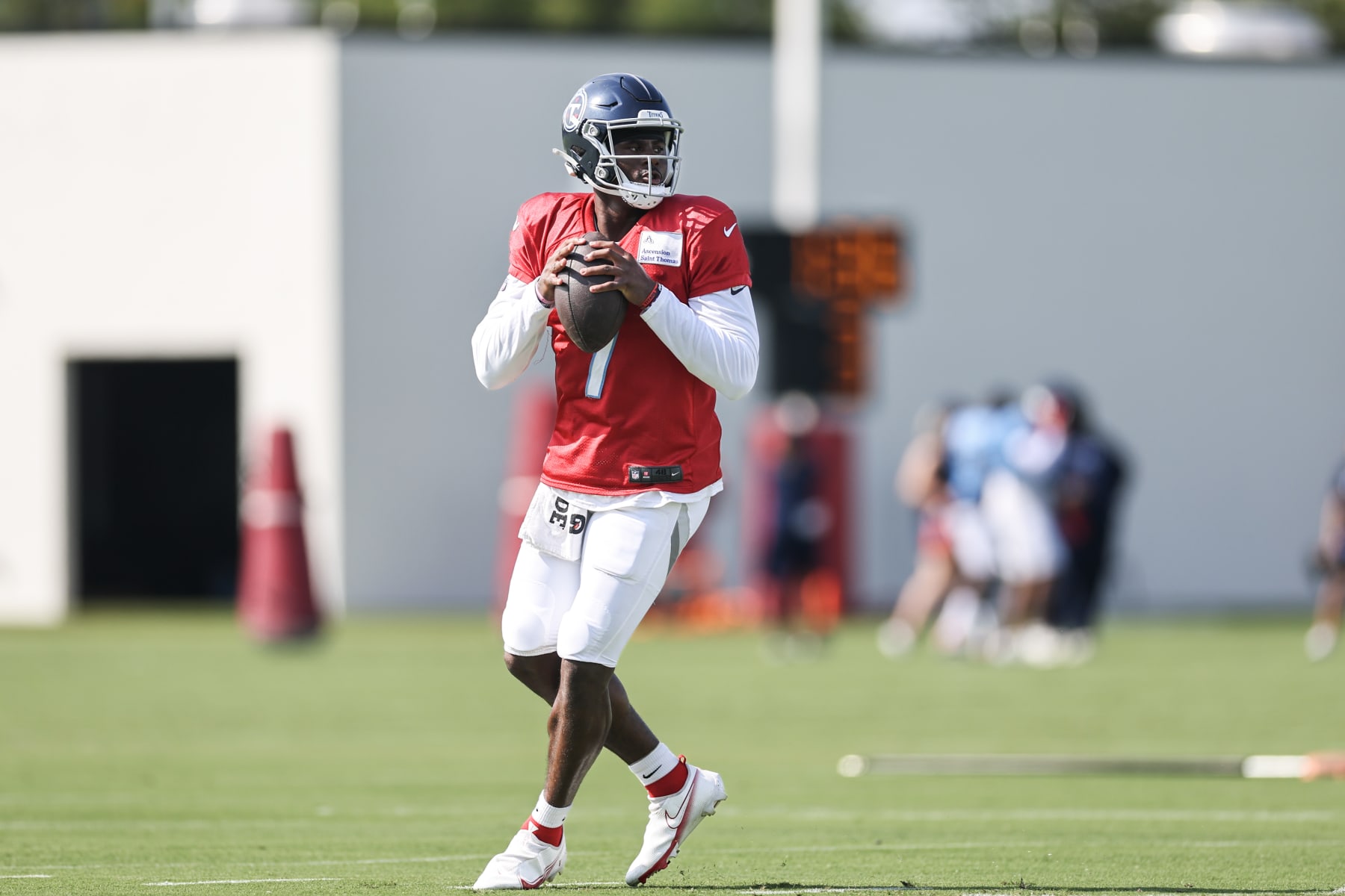 NASHVILLE, TENNESSEE - AUGUST 22: Malik Willis #7 of the Tennessee Titans throws a pass during quarterback drills in the training camp at Ascension Saint Thomas Sports Park on August 22, 2023 in Nashville, Tennessee. (Photo by Silas Walker/Getty Images)