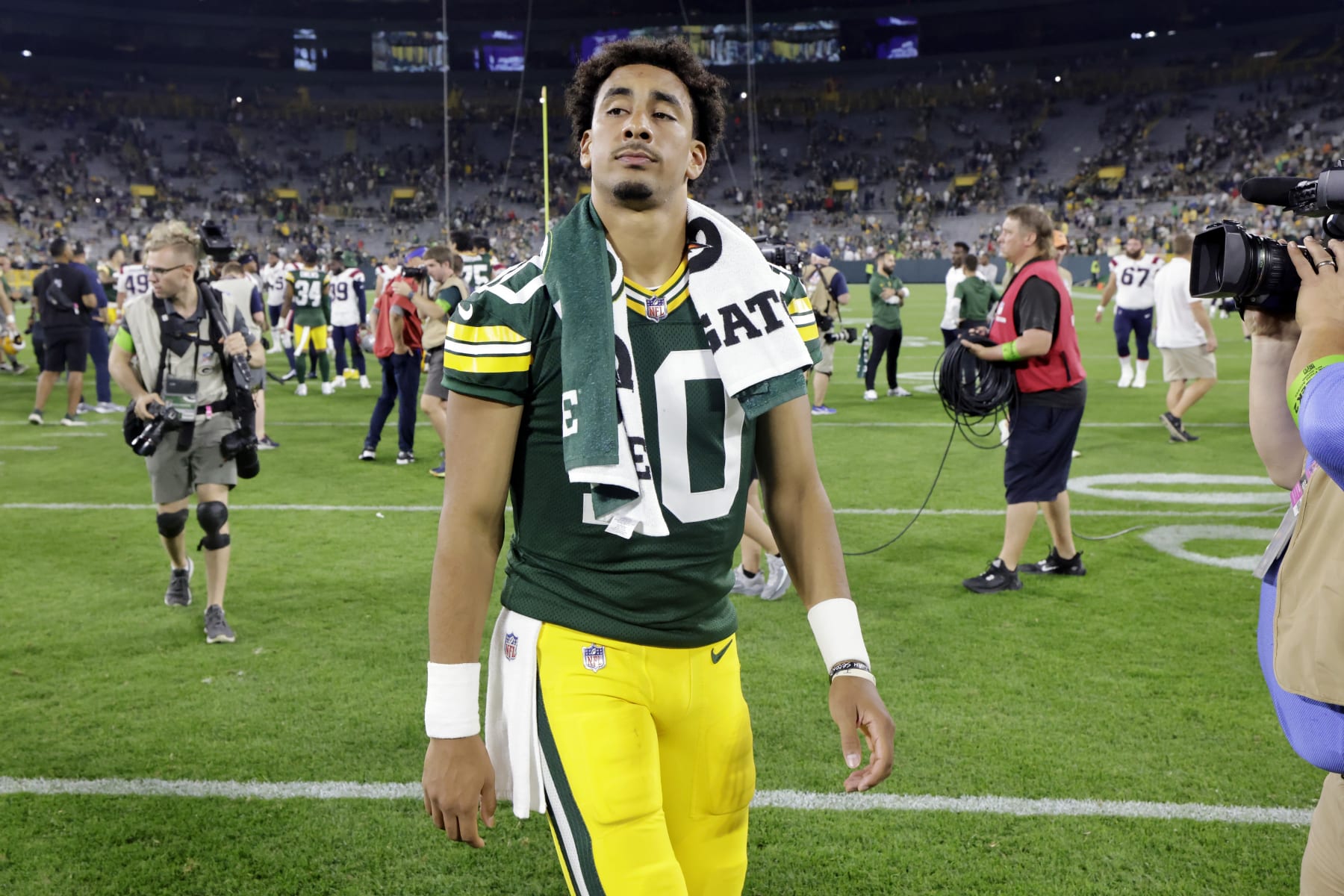 Green Bay Packers quarterback Jordan Love walks off the field after a preseason NFL football game against the New England Patriots, Saturday, Aug. 19, 2023, in Green Bay, Wis. (AP Photo/Mike Roemer)