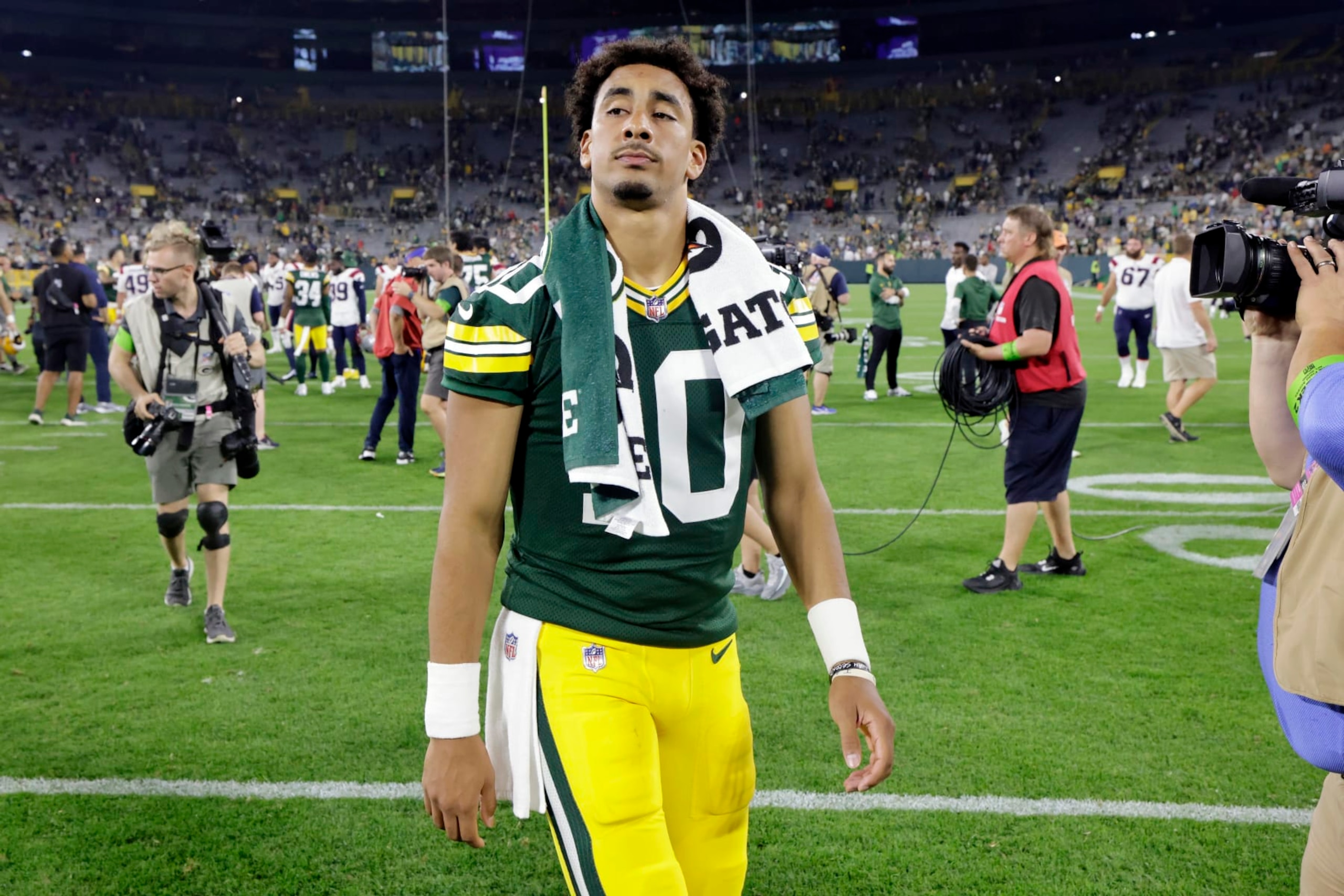 Green Bay Packers quarterback Jordan Love walks off the field after a preseason NFL football game against the New England Patriots, Saturday, Aug. 19, 2023, in Green Bay, Wis. (AP Photo/Mike Roemer)